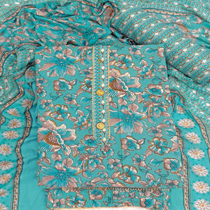 Elegant Turquoise Floral Printed Cotton Blend Dress Material Adorned With Intricate Lace Border