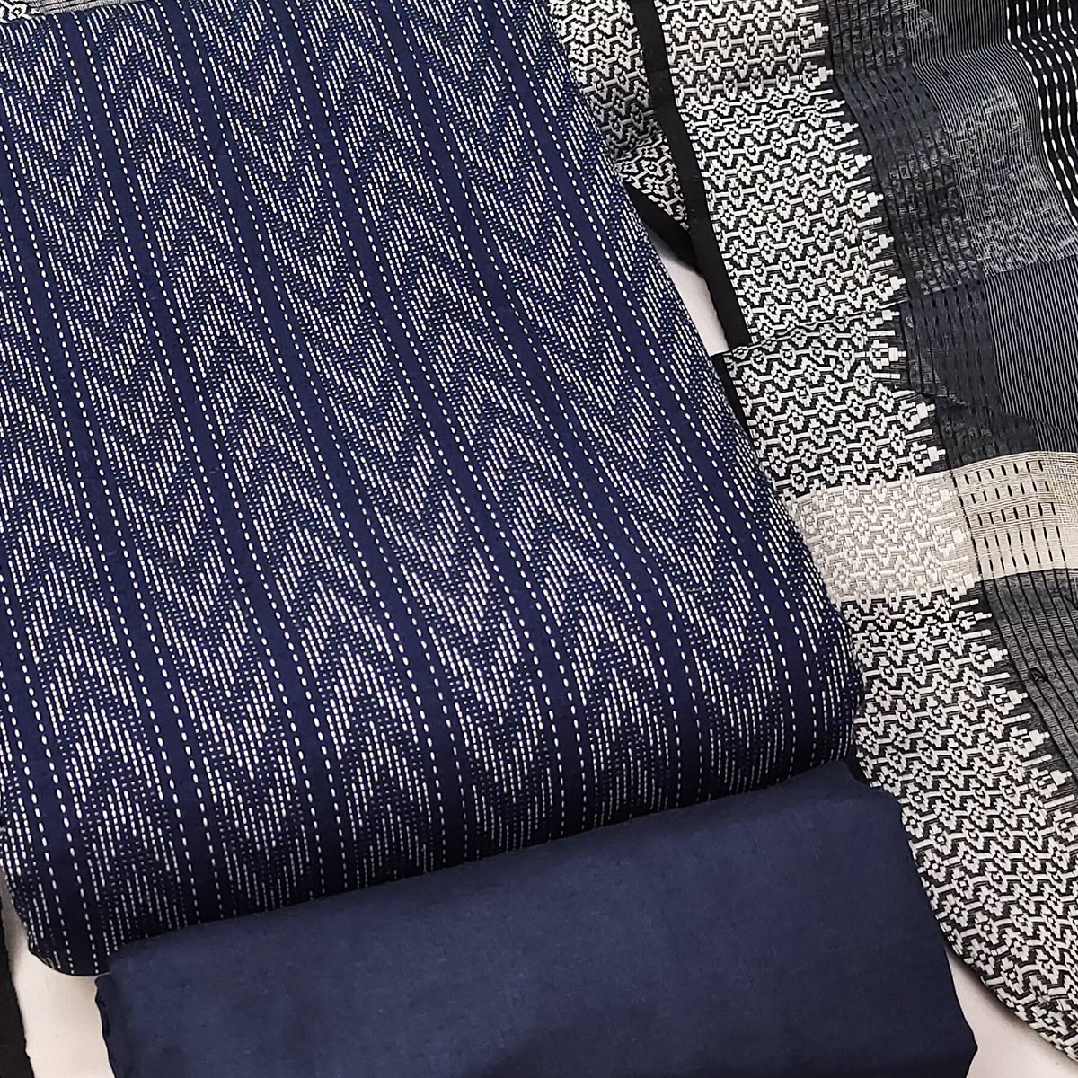 Redefine Elegance With This Navy Blue Chevron Woven Pattern Cotton Blend Dress Material