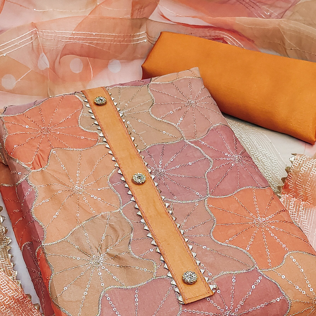 Orange Organza Suit Material with Delicate Sequins Embroidery to Elevate Your Look