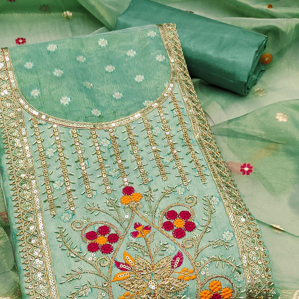 Green Shimmer Dress Material Adorned With Graceful Floral Weaving & Delicate Sequins Embroidery