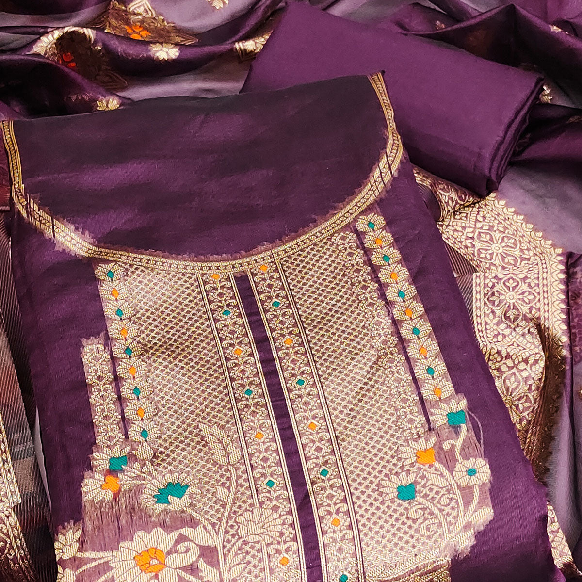 Wine Organza Silk Dress Material Adorned With Exquisite Floral Zari Weaving Work