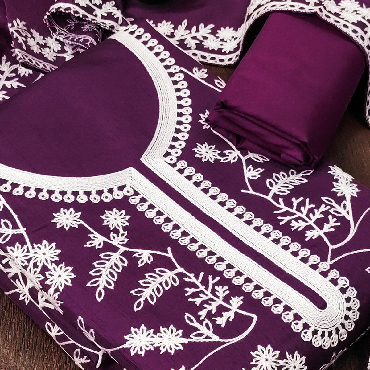 Purple Art Silk Dress Material Adorned With Floral Thread Embroidery Work