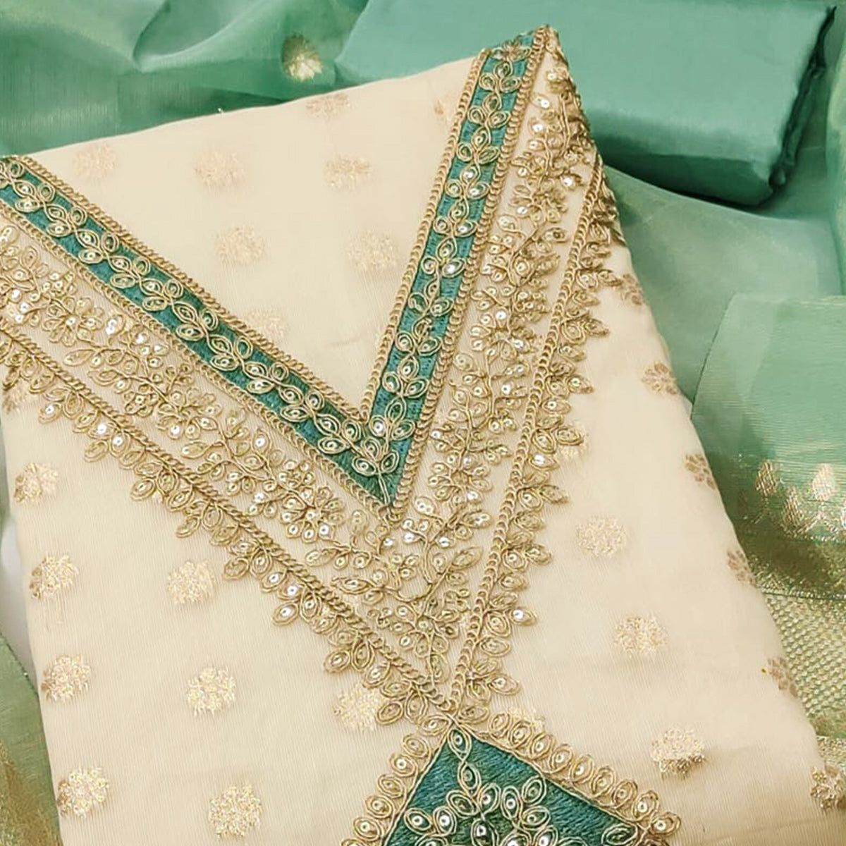 Cream & Green Shimmer Featuring Floral Butti Weaving With Cording Embroidered Dress Material