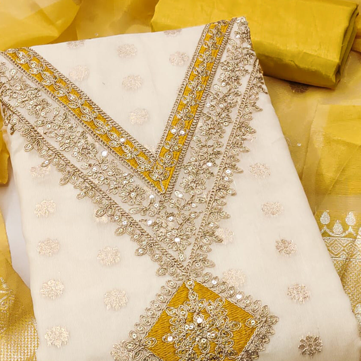 Cream & Yellow Shimmer Featuring Floral Butti Weaving With Cording Embroidered Dress Material