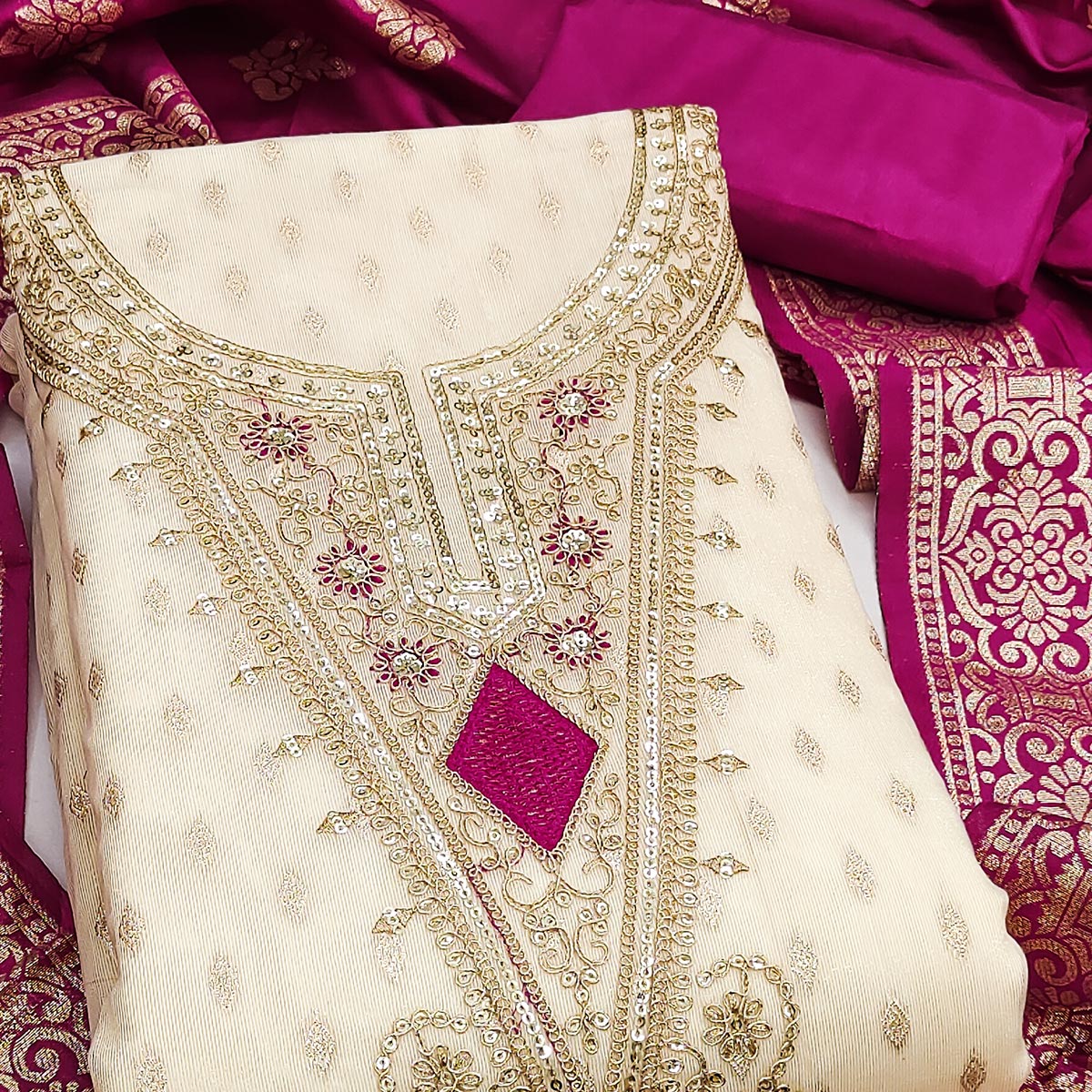 Cream & Rani Pink Floral Butti Weaving With Intricate Cording Embroidered Shimmer Dress Material
