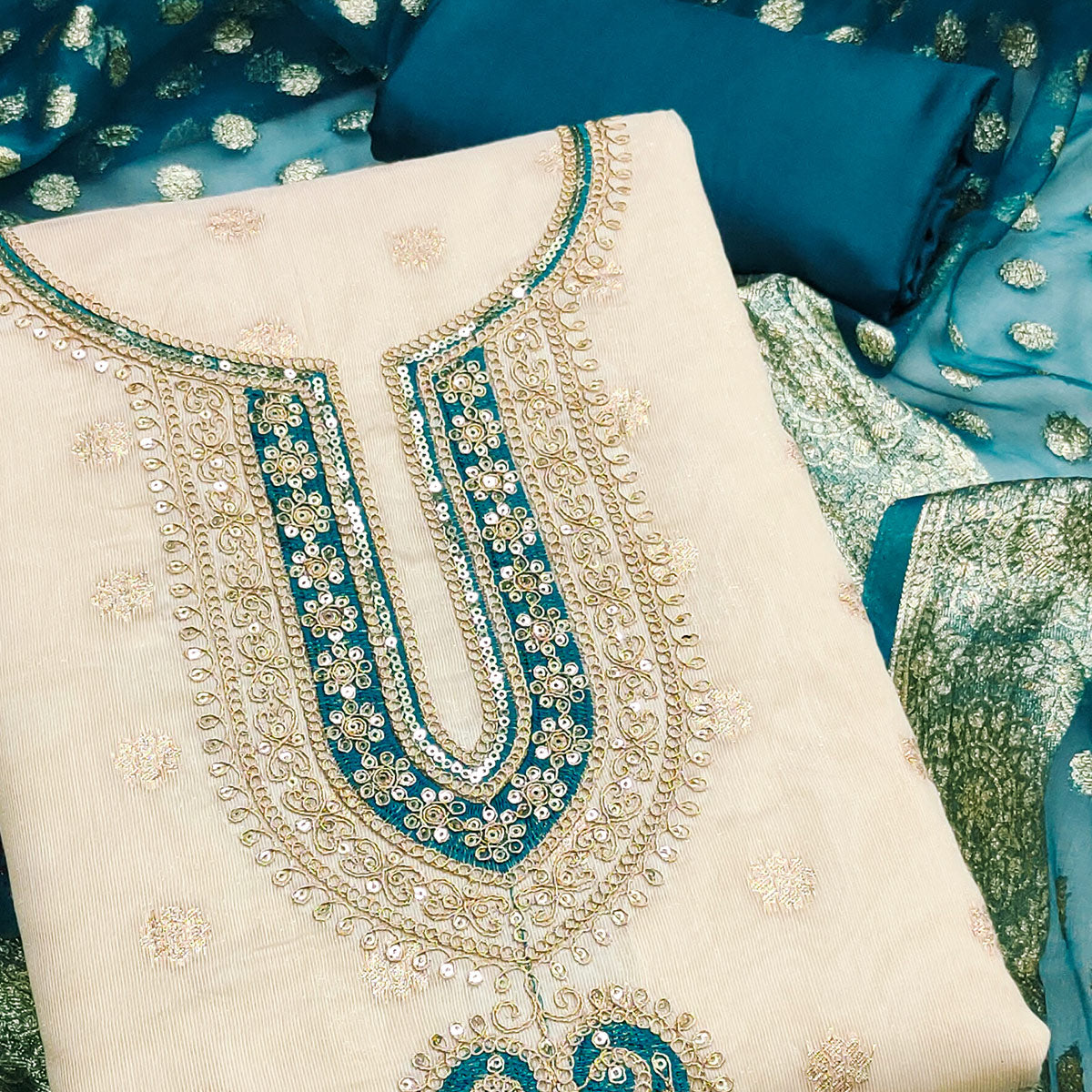 Graceful Cream & Morpich Butti Weaving Shimmer Dress Material Adorned With Cording Embroidery Work