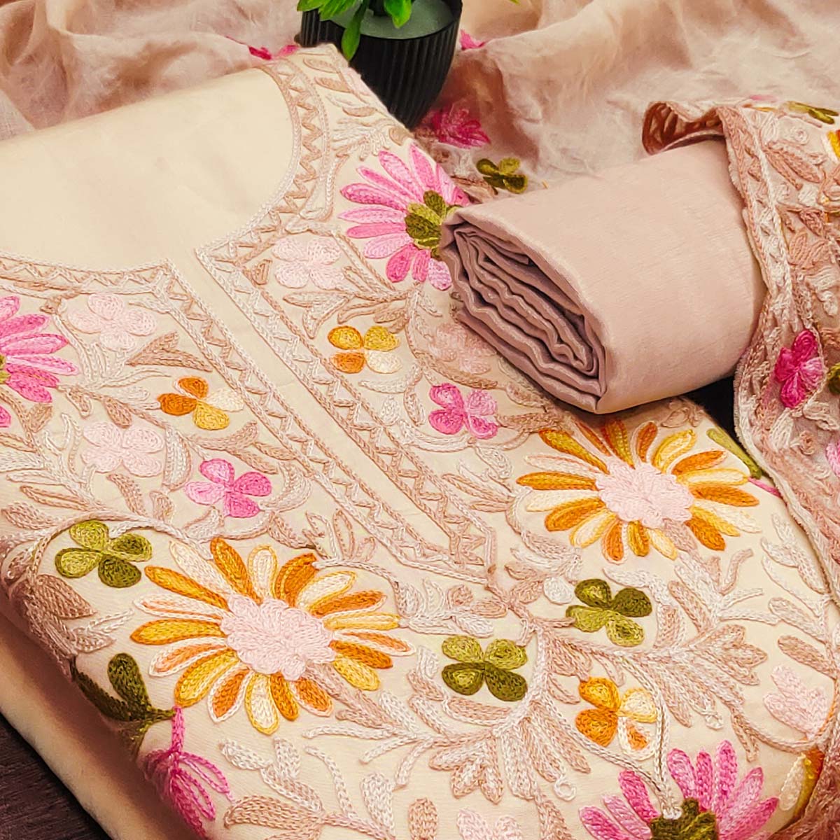 Chikoo Designer Roman Art Silk Dress Material Adorned With Floral Thread Embroidery Work