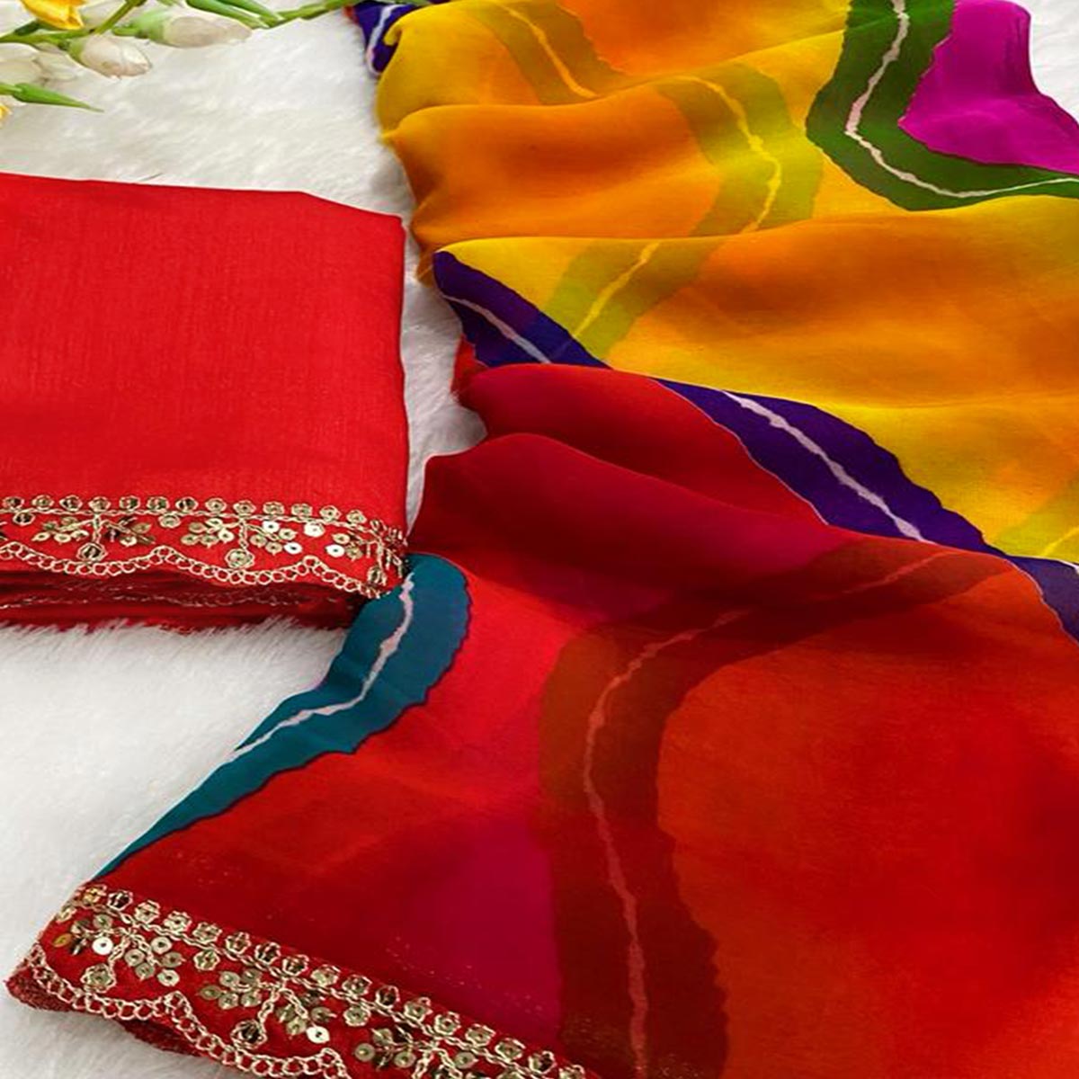 Multicolor Leheriya Print Saree in Flowing Georgette Fabric with Sequins Border Highlight