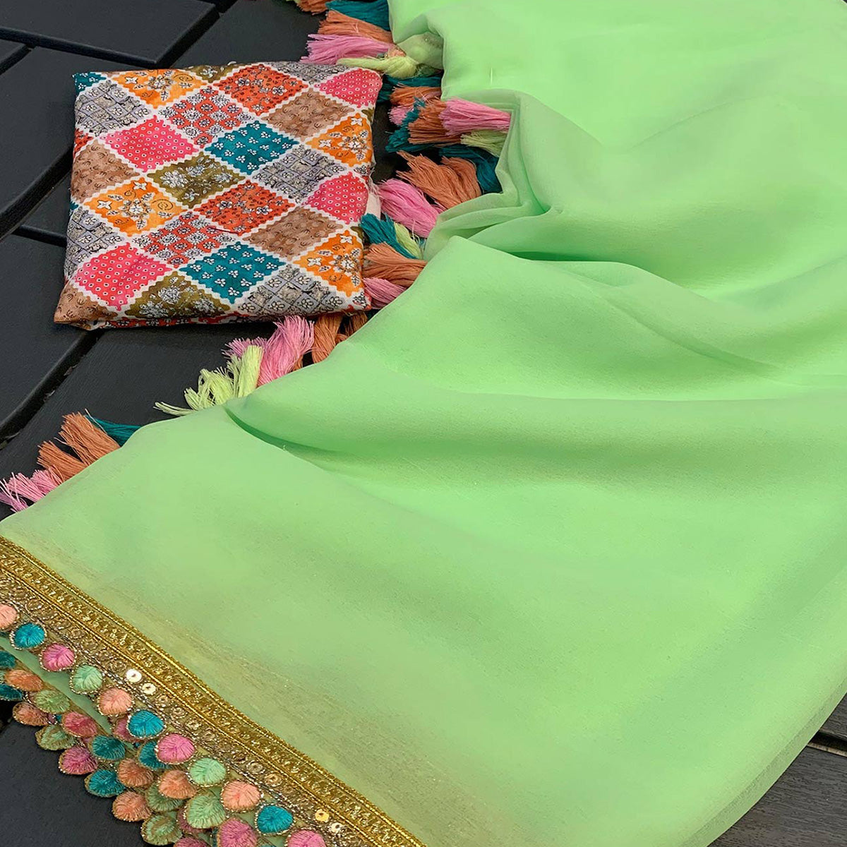 Green Solid Georgette Saree With Sequins Embroidered Border