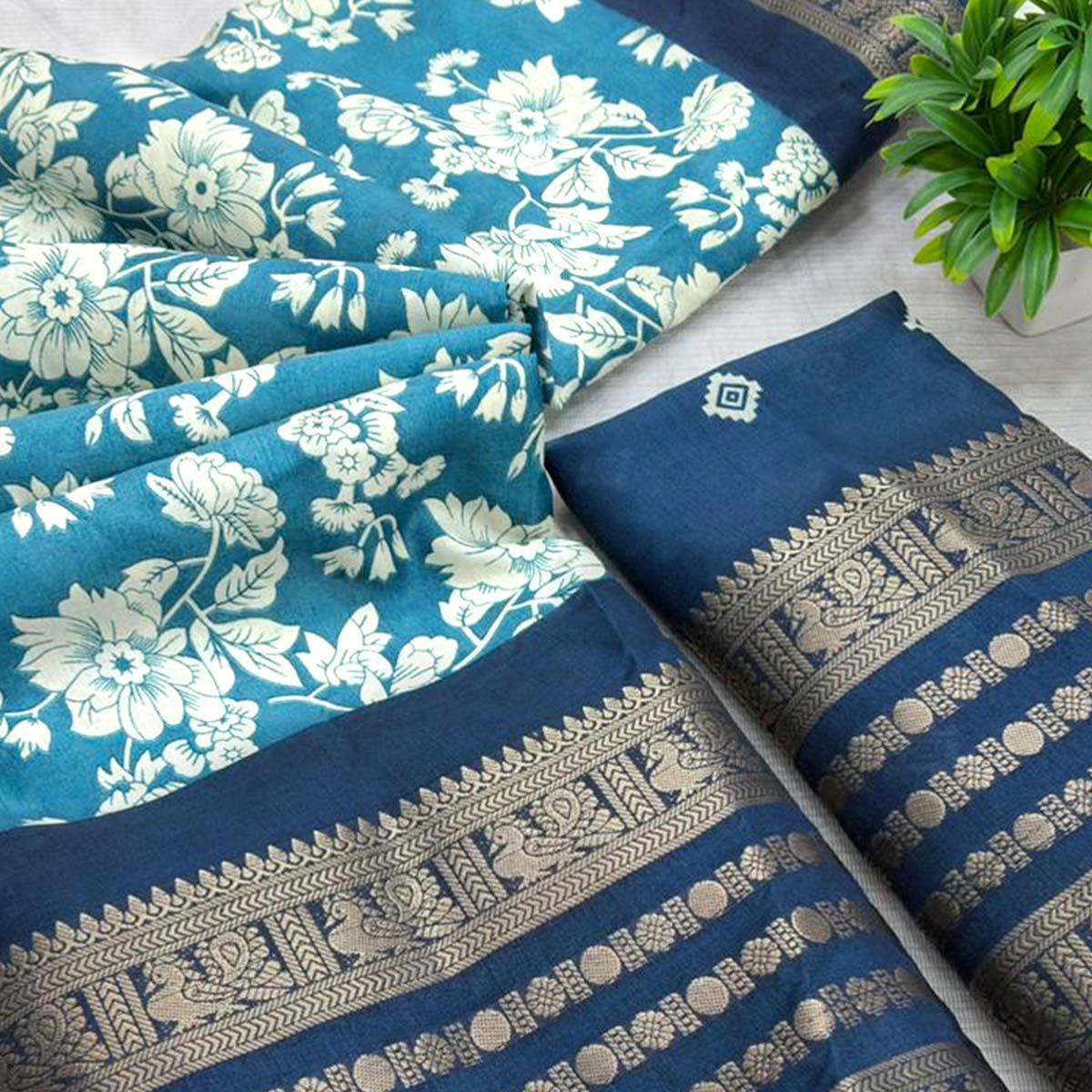 Luxurious Teal Blue Floral Print Dola Silk Saree With Intricate Peacock Motif Zari Woven Border