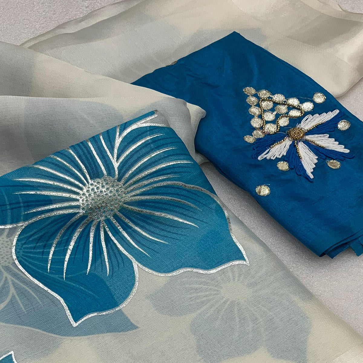 White & Sky Blue Floral Foil Printed Organza Saree