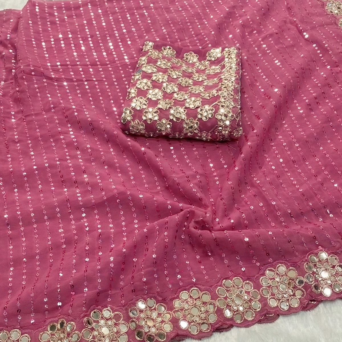 Stunning Pink Georgette Party Wear Saree Adorned with Heavy Sequins Embellishment
