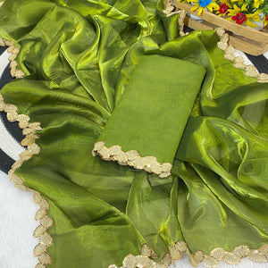 Green Tissue Saree Featuring Solid Finish and Delicate Lace Work by Jimmy Choo Style