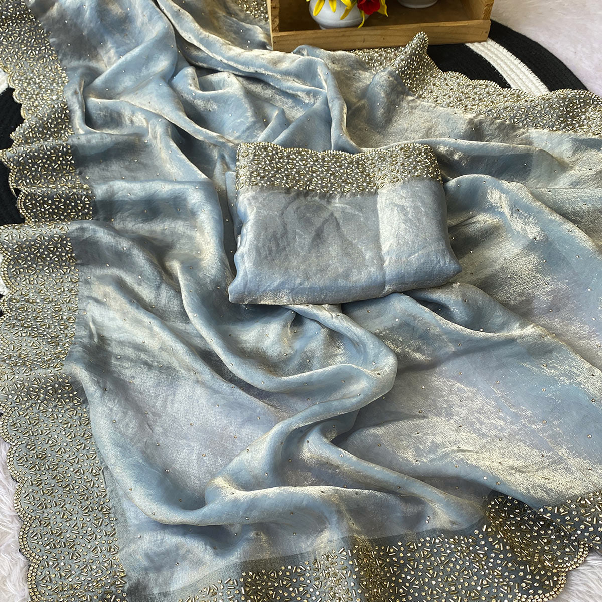 Greyish Blue Fandy Satin Saree Featuring Intricate Swarovski Work & Decorative Zarkan Border