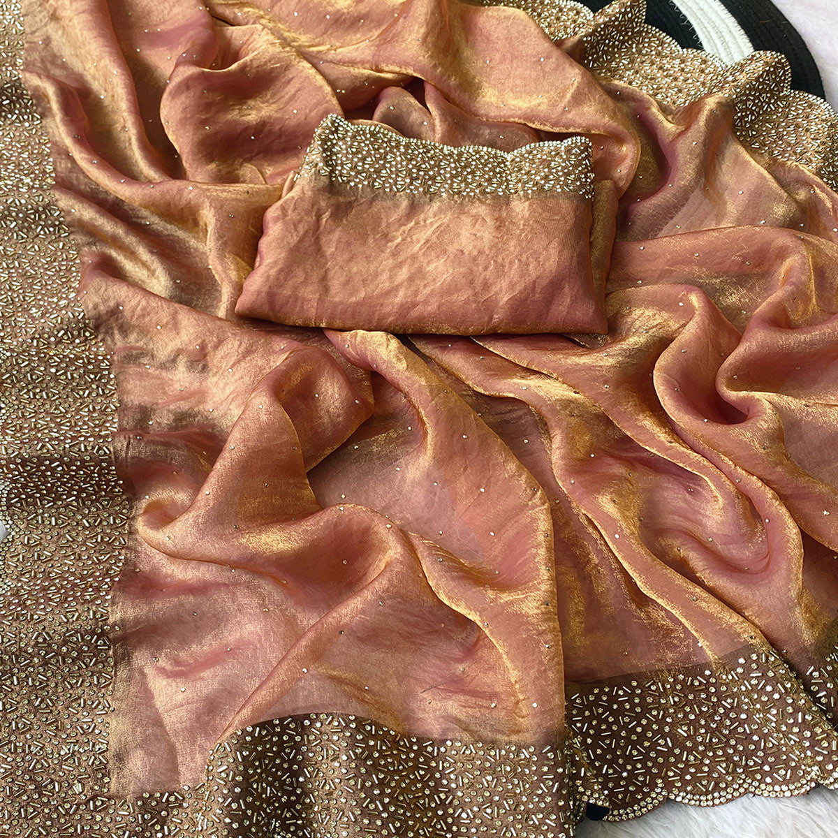 Peach Fandy Satin Saree Featuring Intricate Swarovski Work & Decorative Zarkan Border