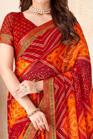 Maroon & Orange Bandhani Printed Chiffon Saree Enhanced with Delicate Lace Border Work