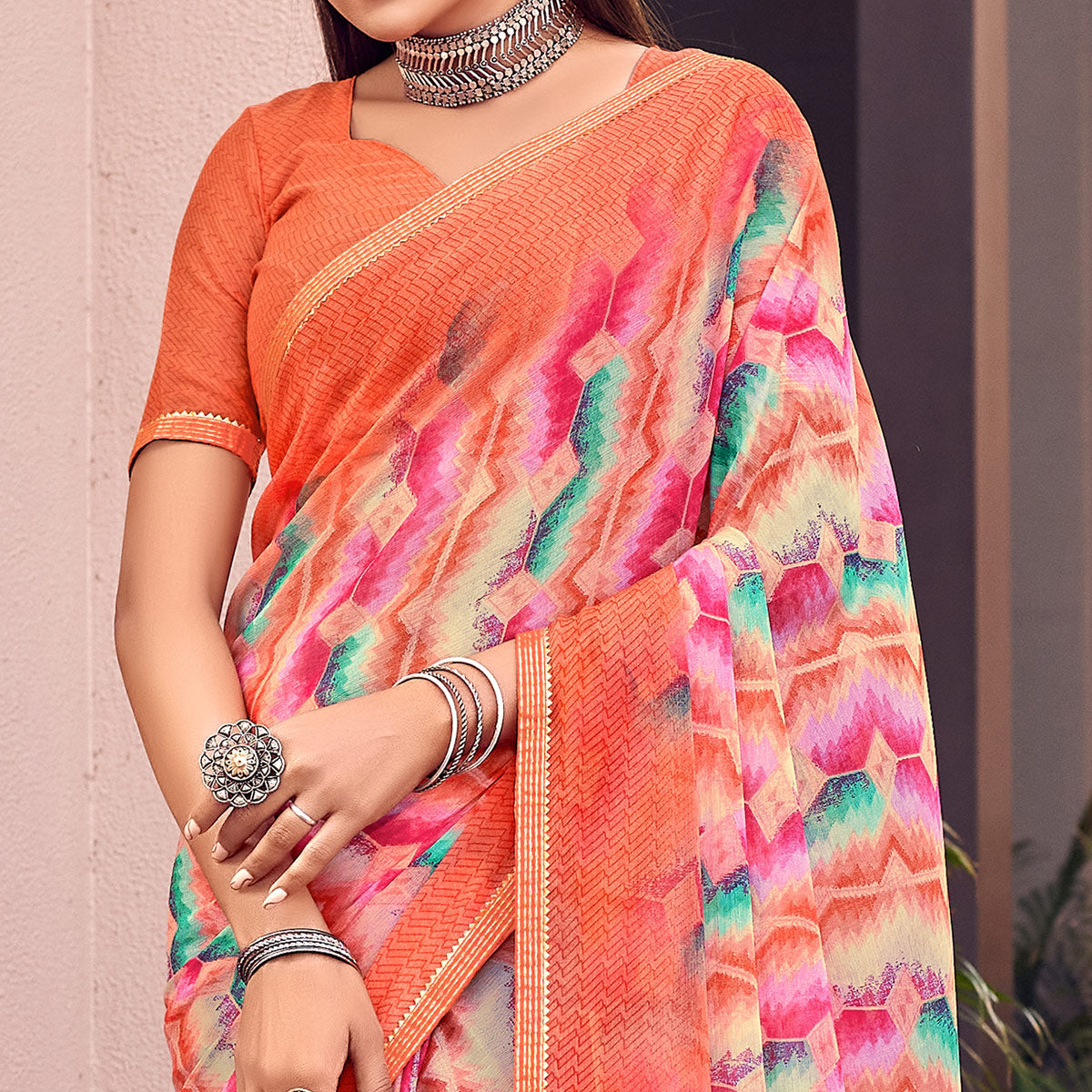 Orange Printed Chiffon Saree With Tassels