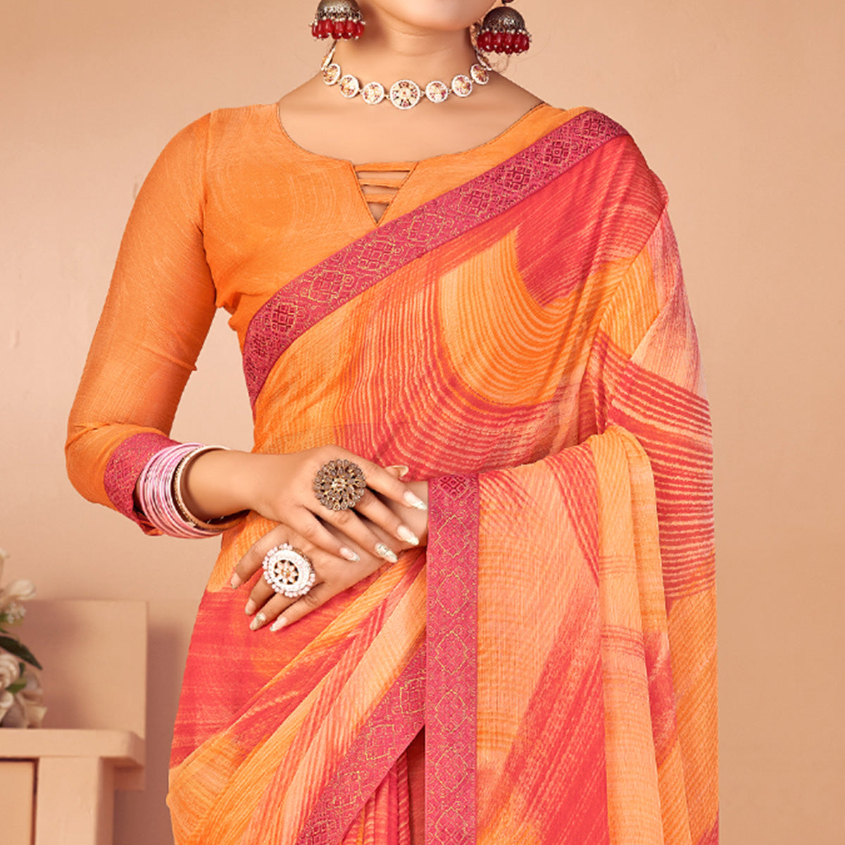 Orange Printed Chiffon Saree With Lace Border