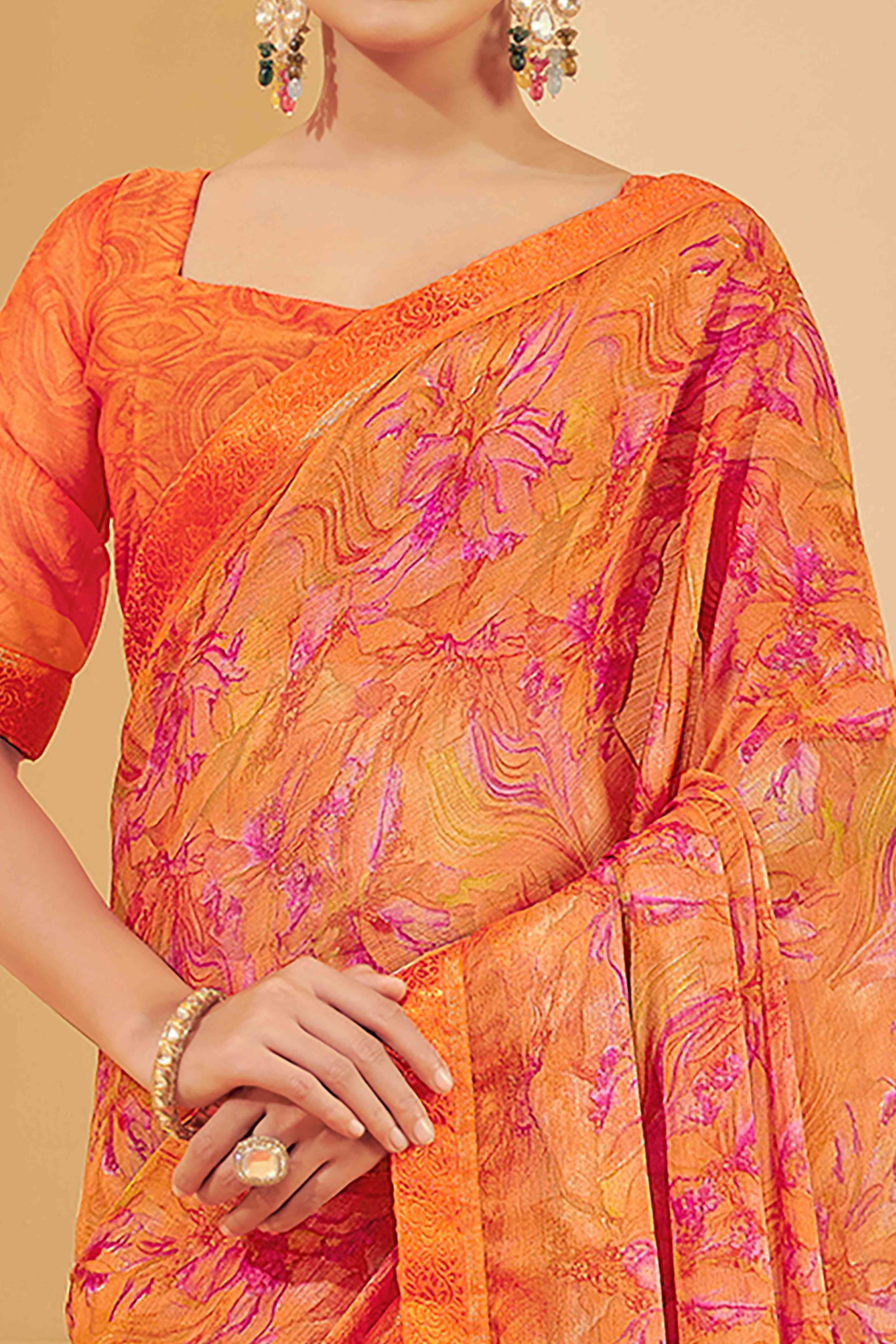 Orange Chiffon Saree Adorned With Artistic Floral Print & Finely Crafted Woven Lace Border