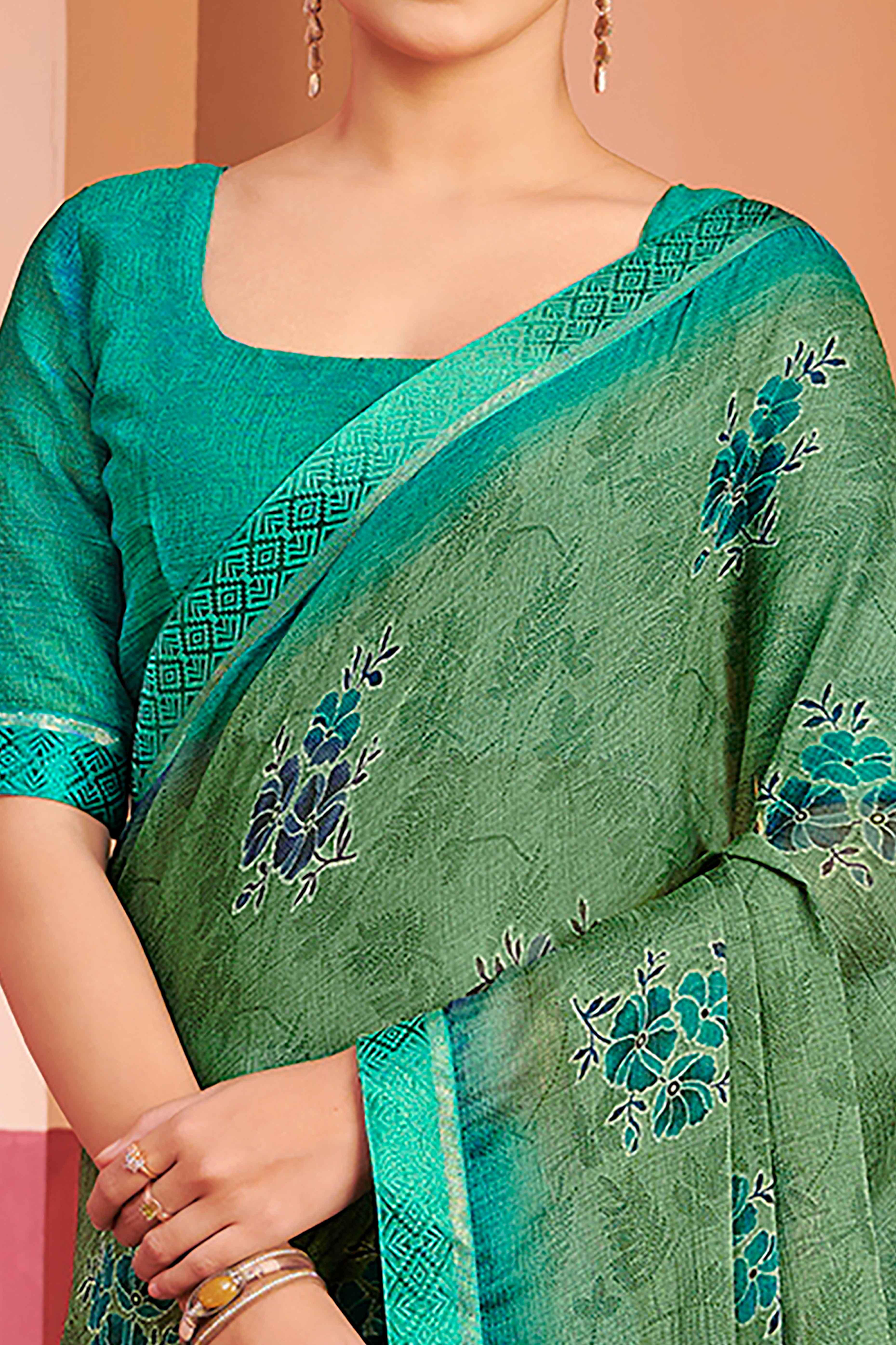 Green Chiffon Saree Featuring Delicate Floral Prints & A Graceful Lace Border
