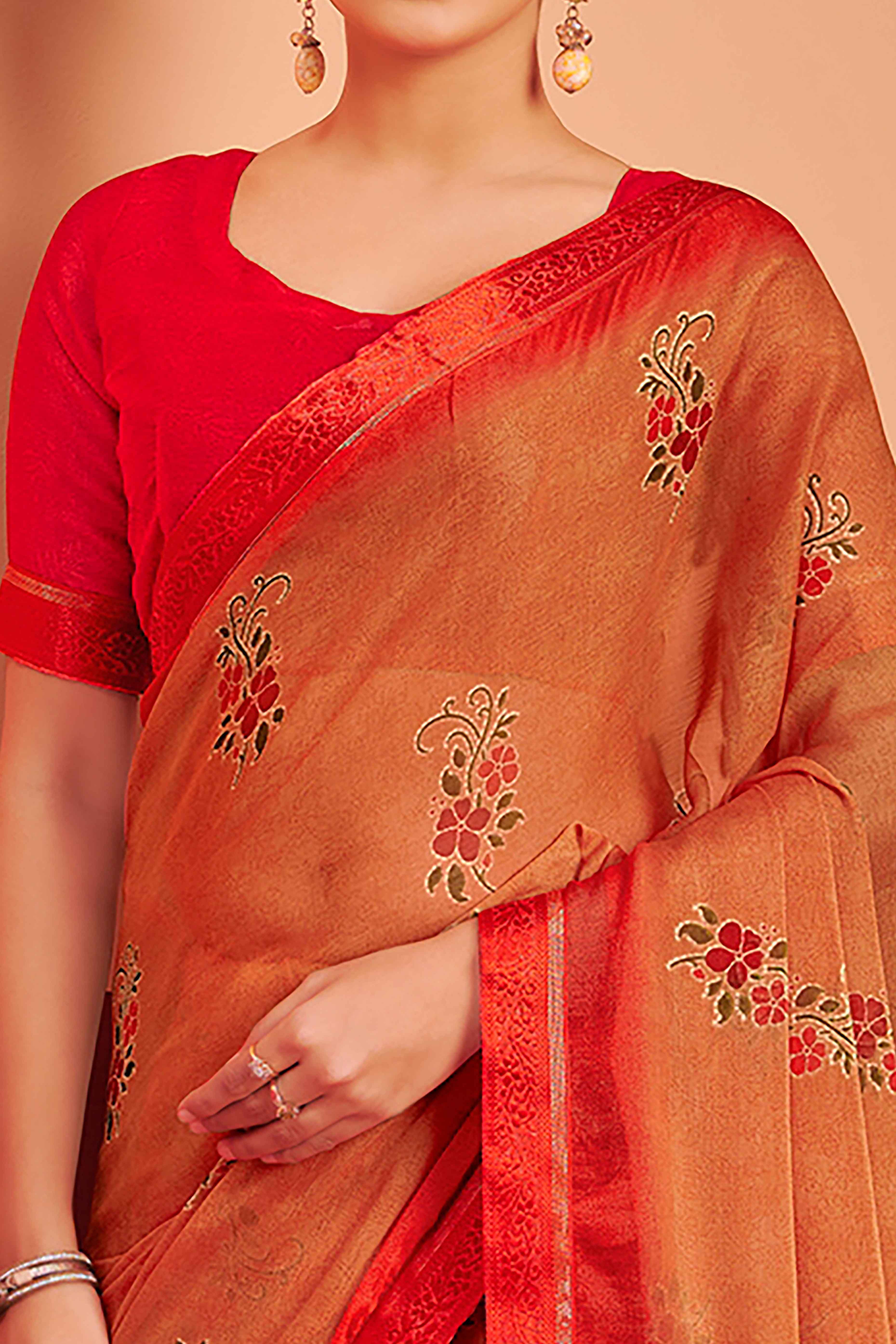 Orange Chiffon Saree Featuring Delicate Floral Prints & A Graceful Lace Border