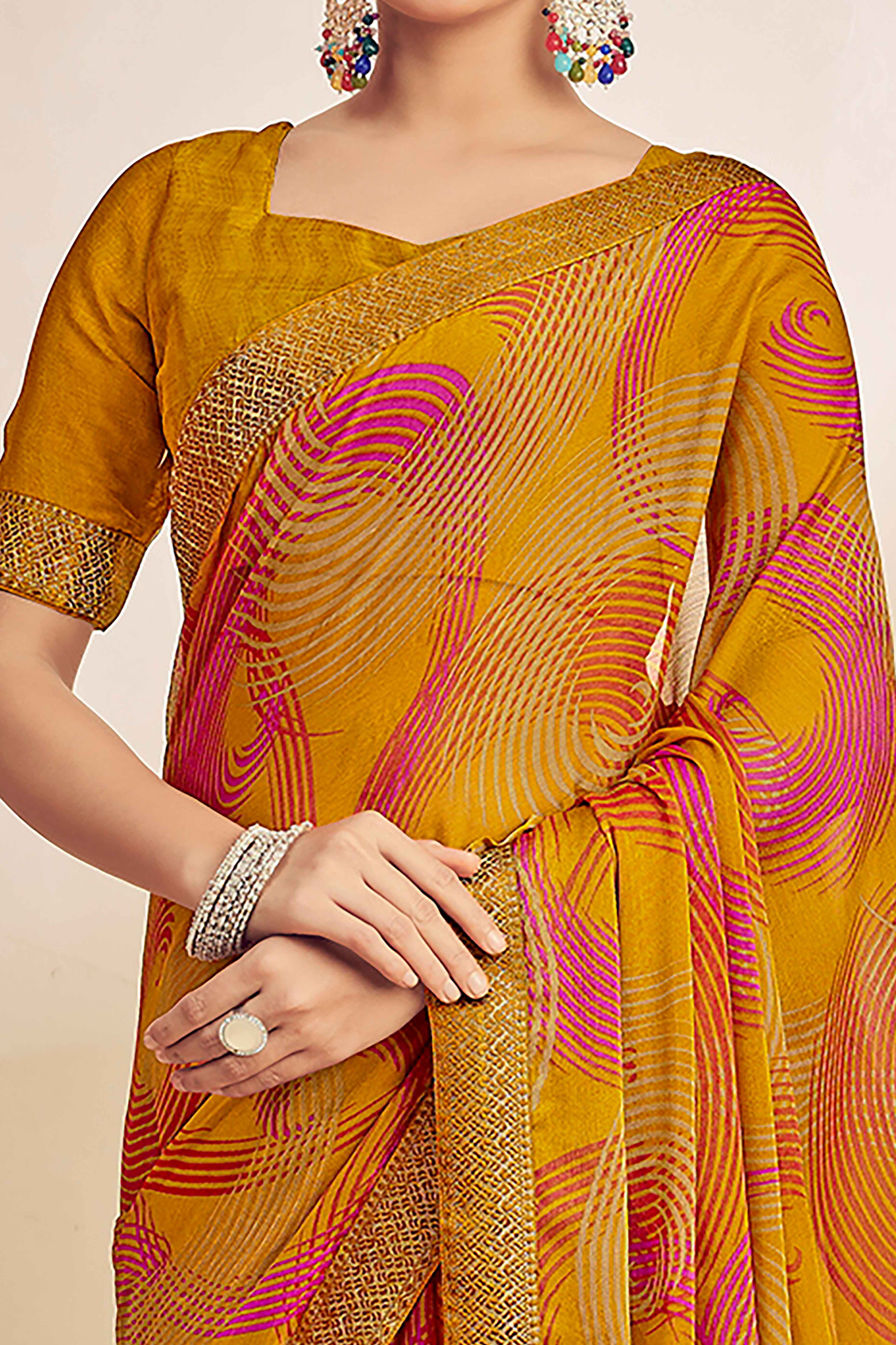 Mustard Chiffon Saree Adorned With Artistic Print & Finely Crafted Woven Lace Border