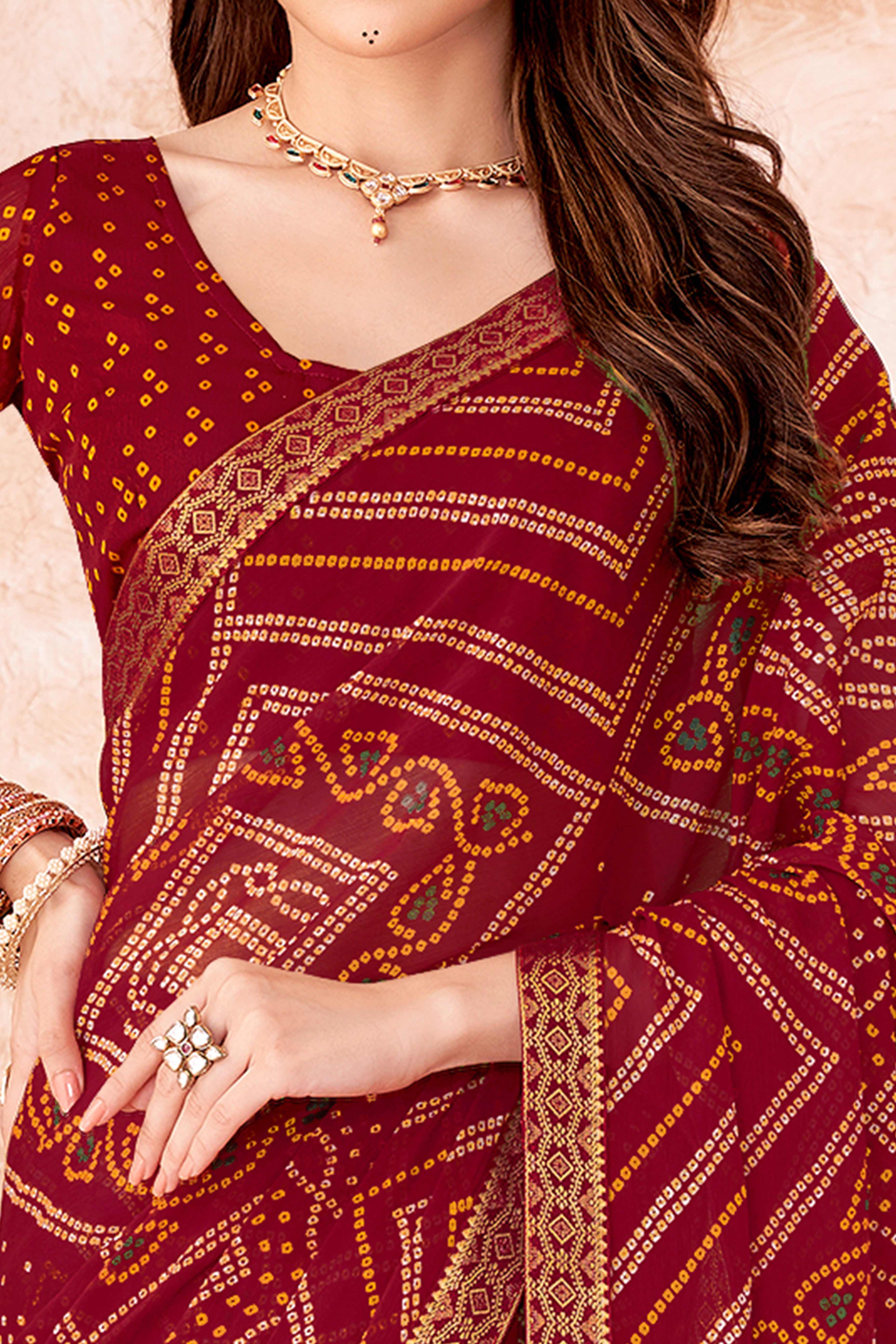 Maroon Chiffon Saree Featuring Traditional Bandhani Prints & A Graceful Lace Edge