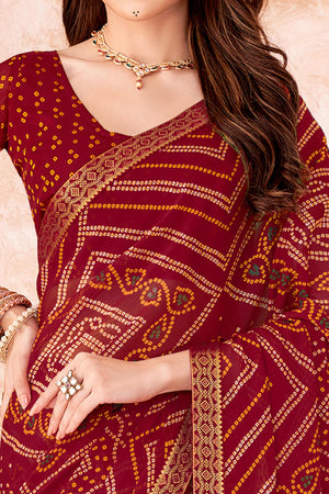 Maroon Chiffon Saree Featuring Traditional Bandhani Prints & A Graceful Lace Edge