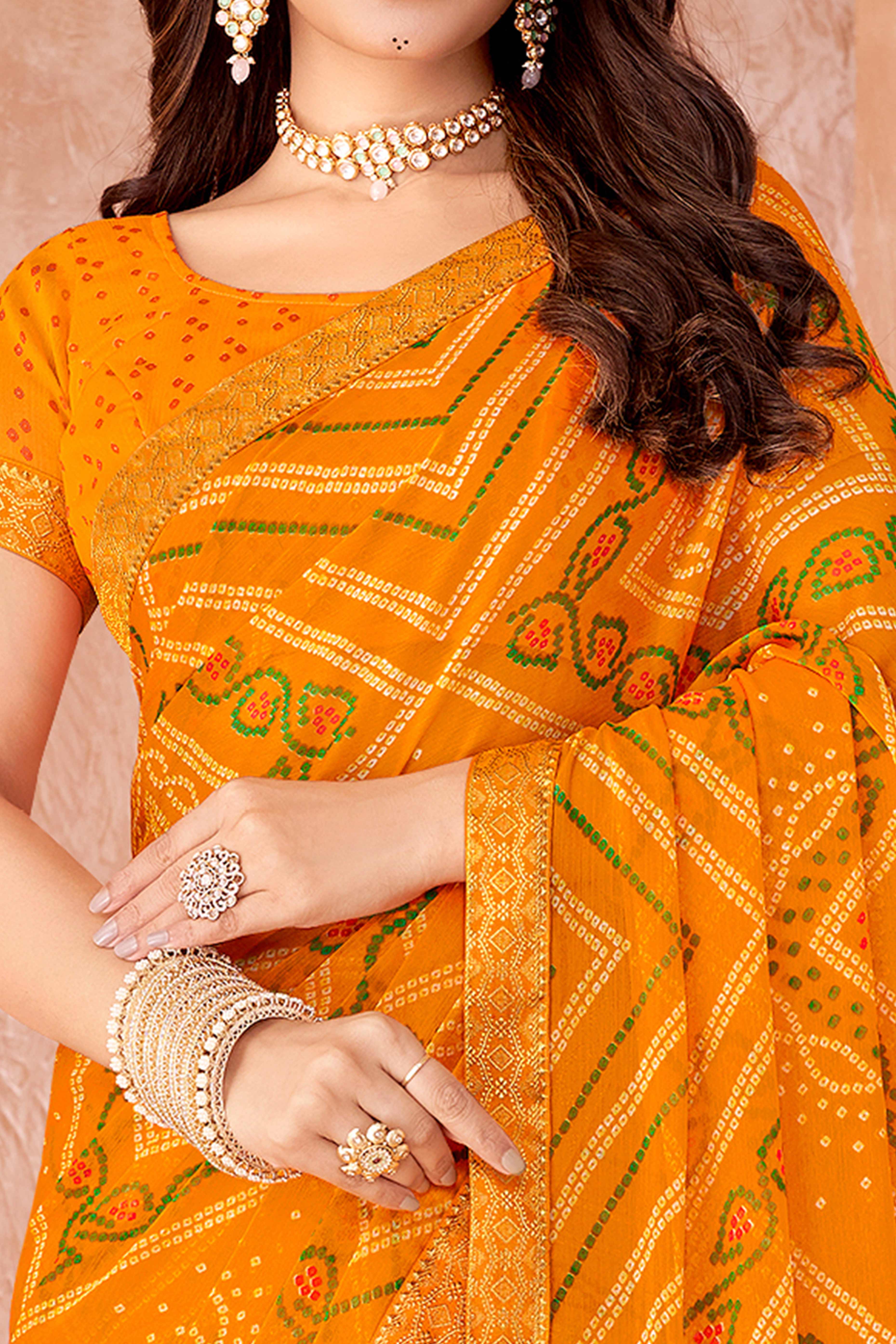Mustard Chiffon Saree Featuring Traditional Bandhani Prints & A Graceful Lace Edge