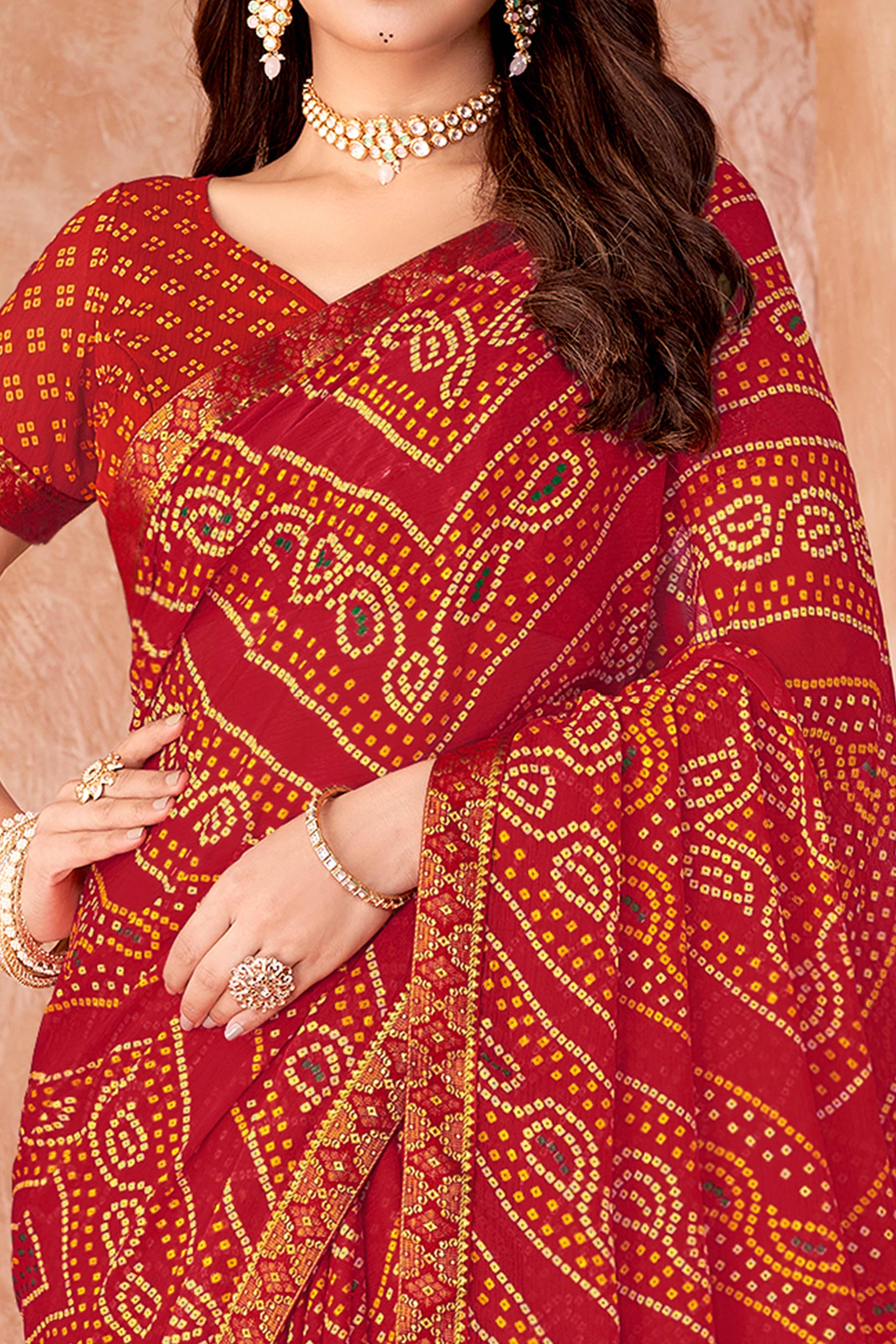 Red Chiffon Saree Featuring Traditional Bandhani Prints & A Graceful Lace Edge