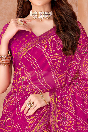 Magenta Chiffon Saree Featuring Traditional Bandhani Prints & A Graceful Lace Edge
