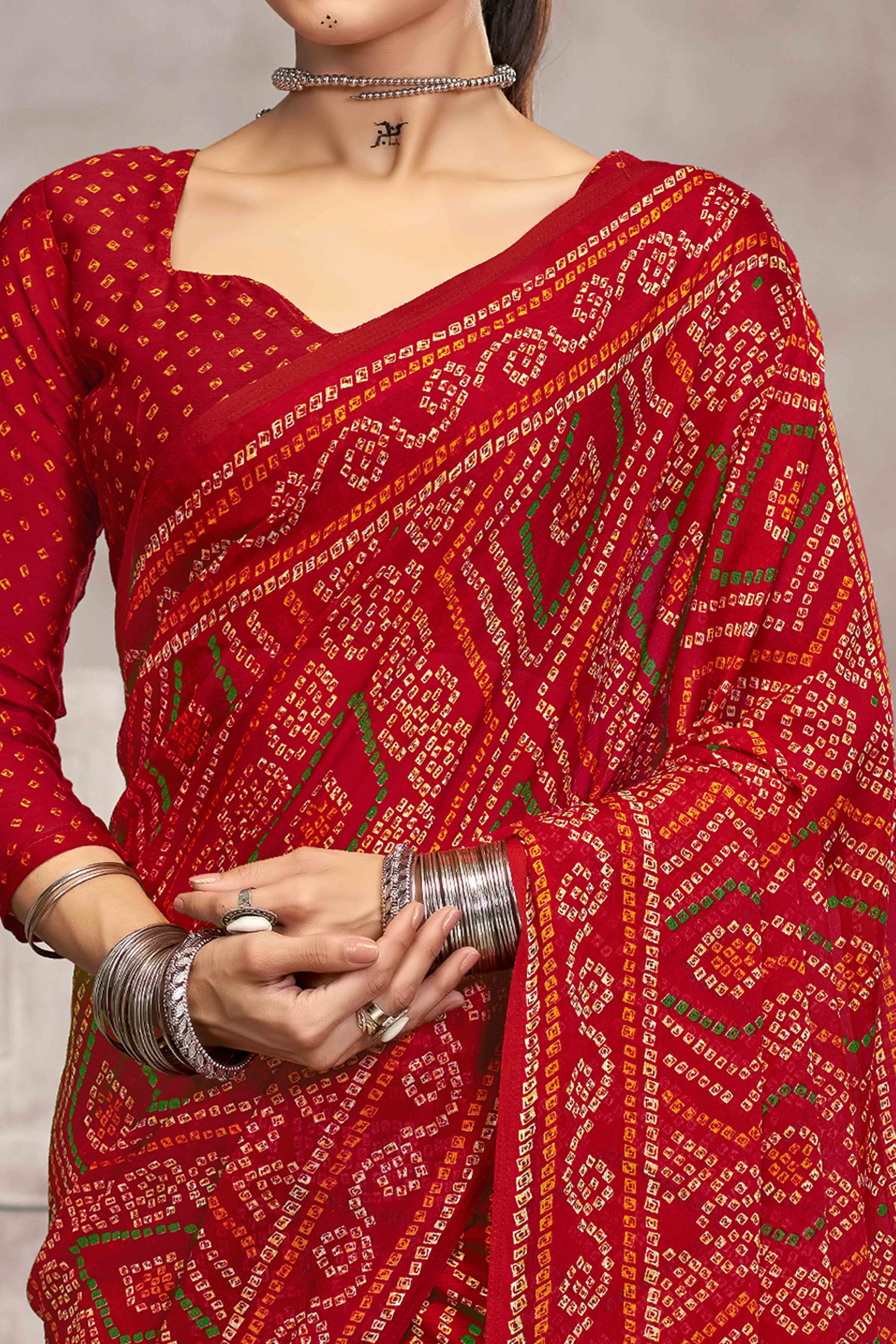 Red Chiffon Saree Features Bandhani Print for Casual Occasion