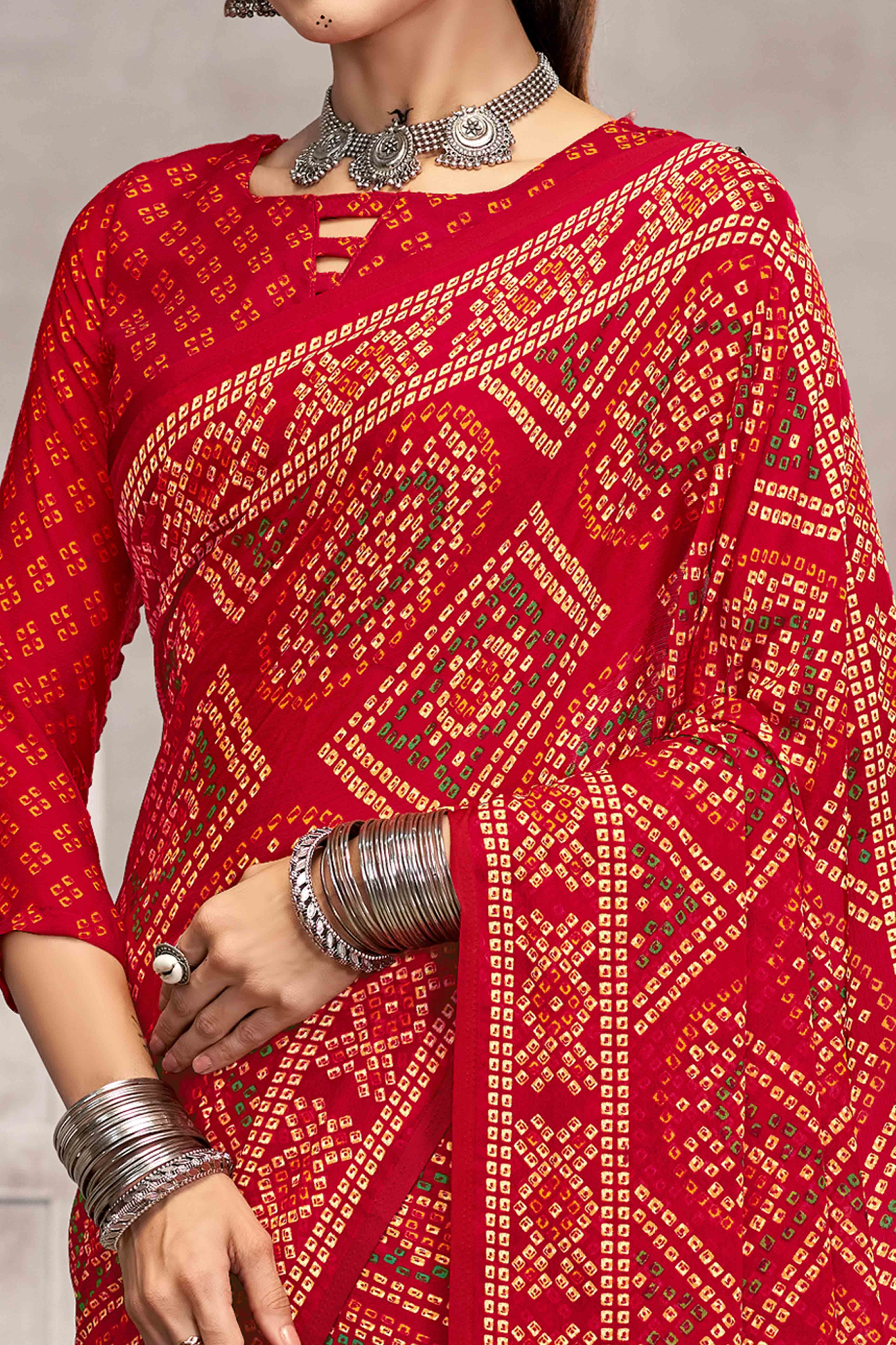 Red Chiffon Saree Features Bandhani Print for Casual Occasion