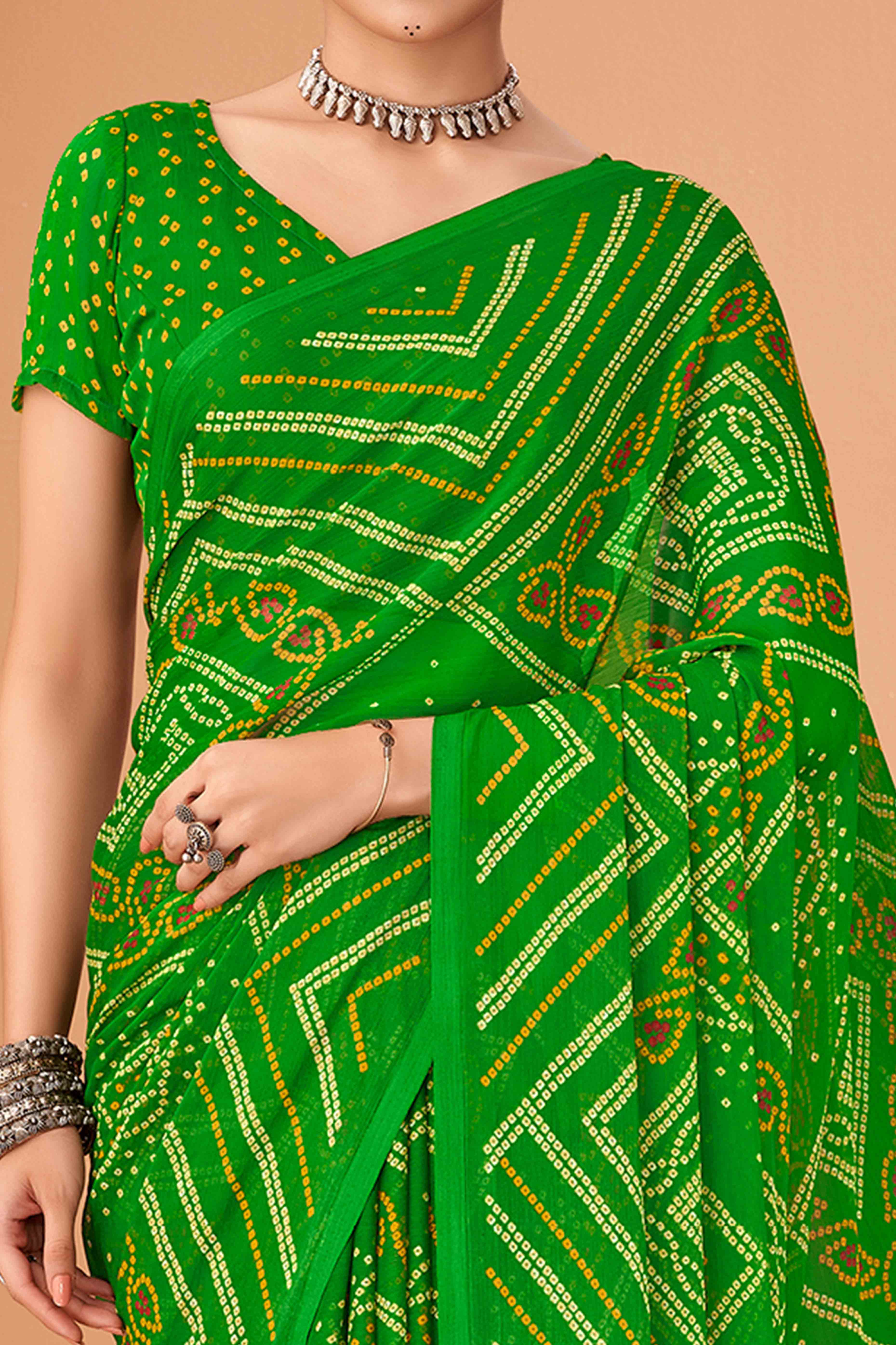 Green Bandhani Printed Chiffon Saree Accented With Intricate Lace Border Work