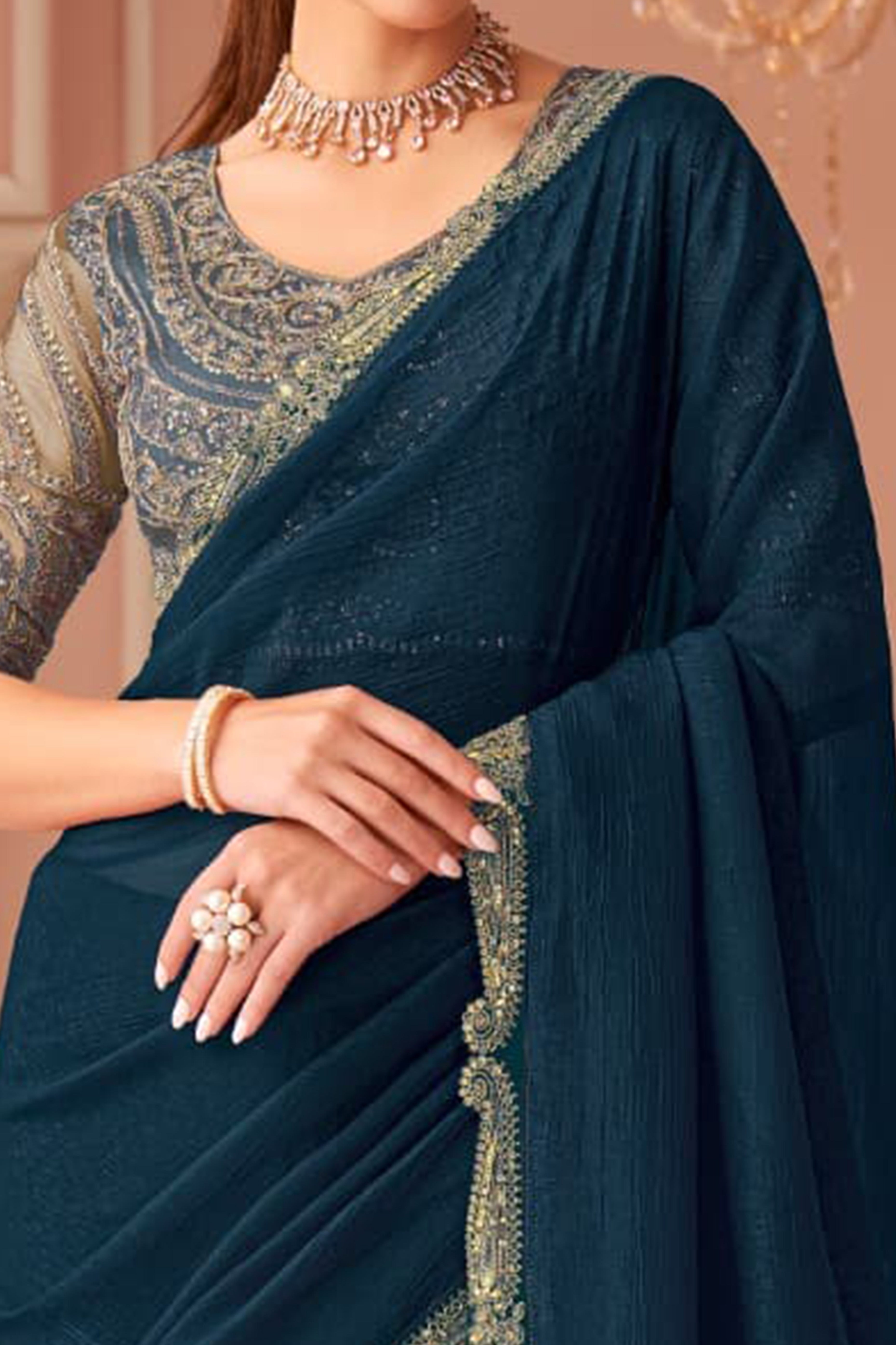 Graceful Teal Georgette Saree with Intricate Sequin Embroidery Detailing