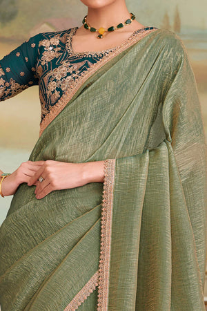 Captivating Pista Green Georgette Saree Beautified With Floral Sequins Embroidery Lace Border