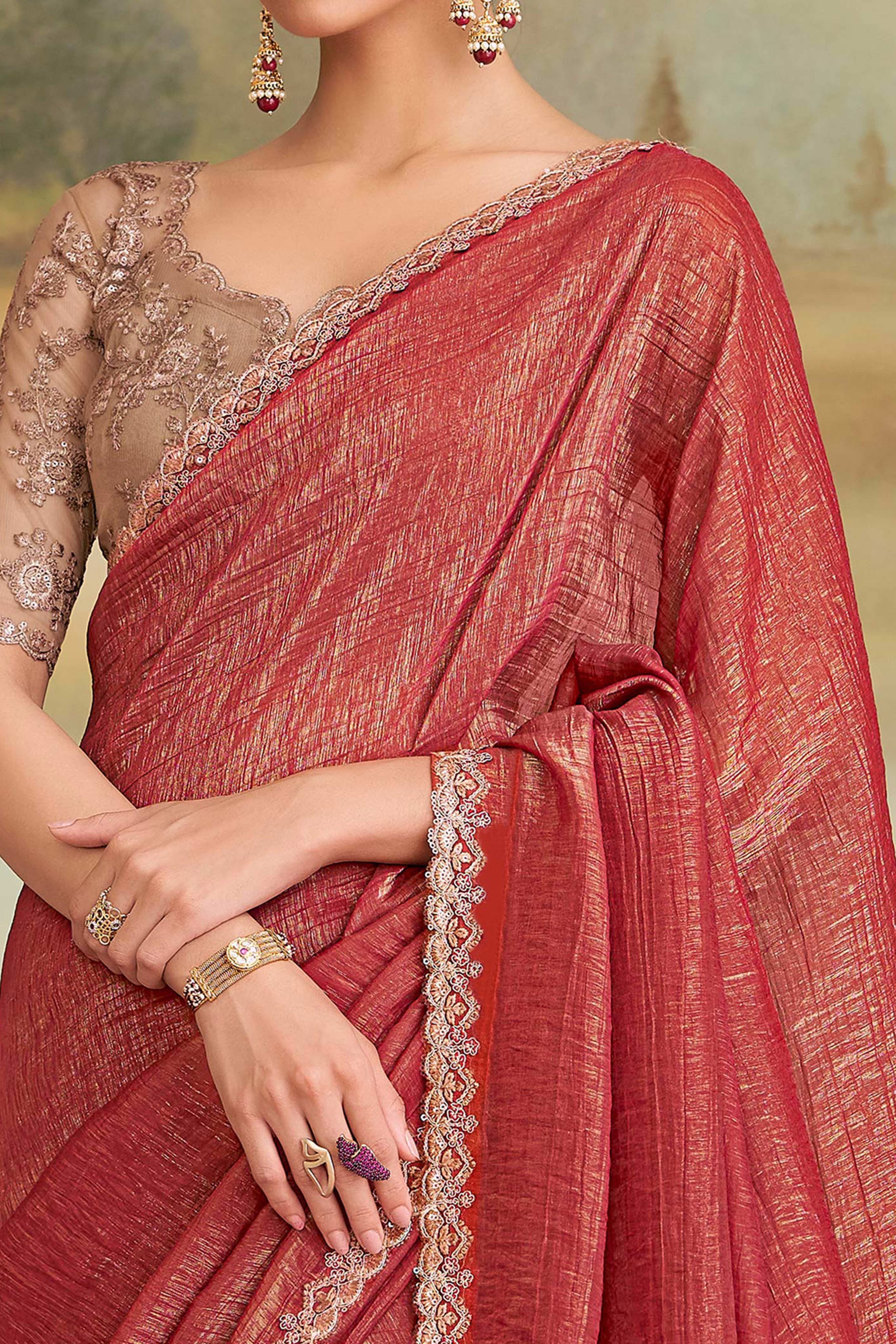 Graceful Brick Red Georgette Saree Adorned With Floral Sequins Embroidered Lace Border Work