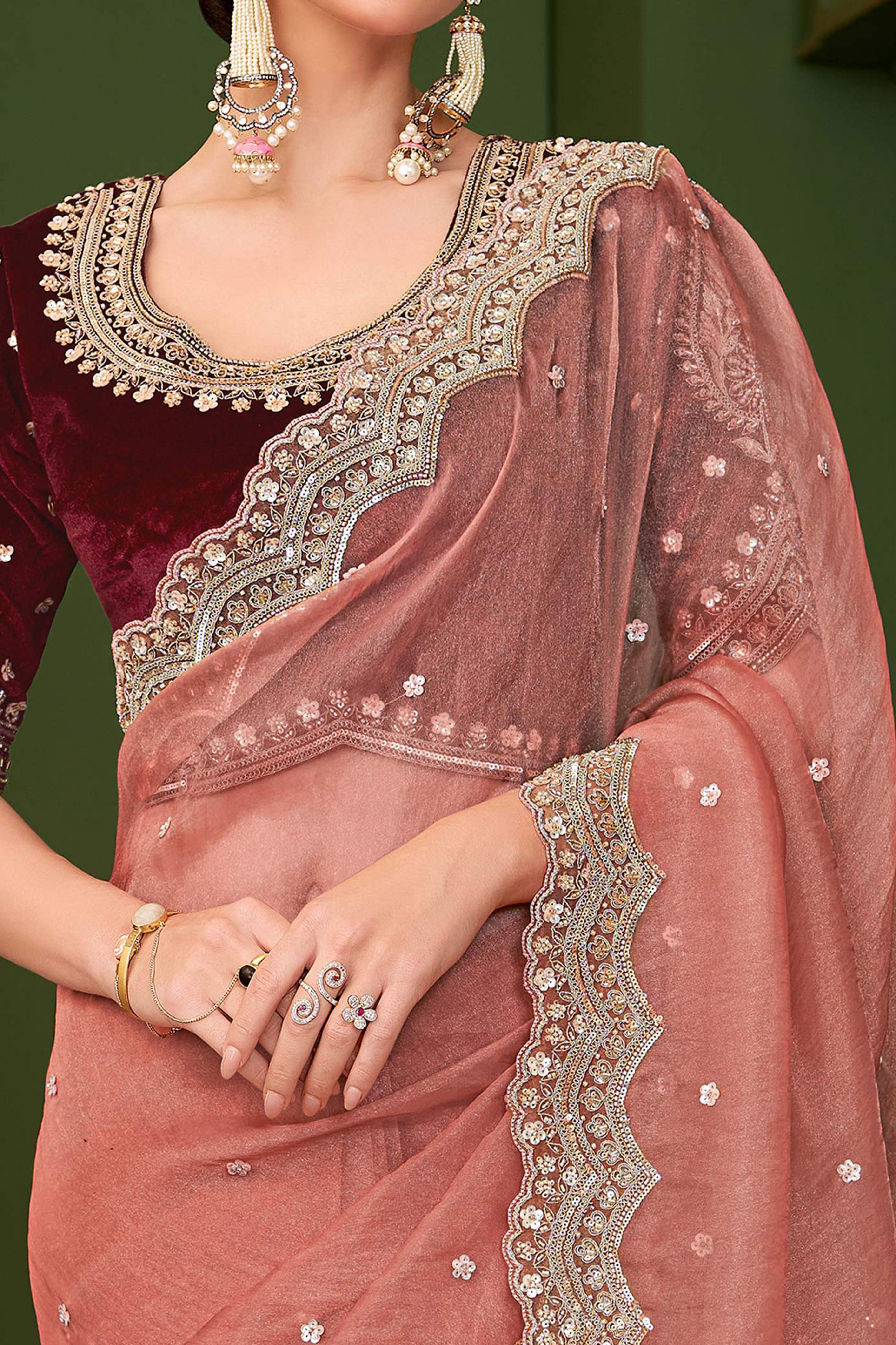 Charming Peach Georgette Saree Adorned With Floral Cording Sequins Embroidery & Cutwork Border