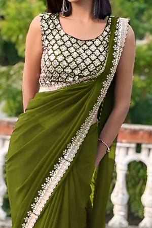 Green Georgette Saree With Sleek Solid Finish And Embroidered Edging