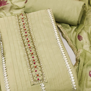 Green Cotton Silk Dress Material Embellished With Elegant Moti Handwork & Delicate Gota Patti Lace