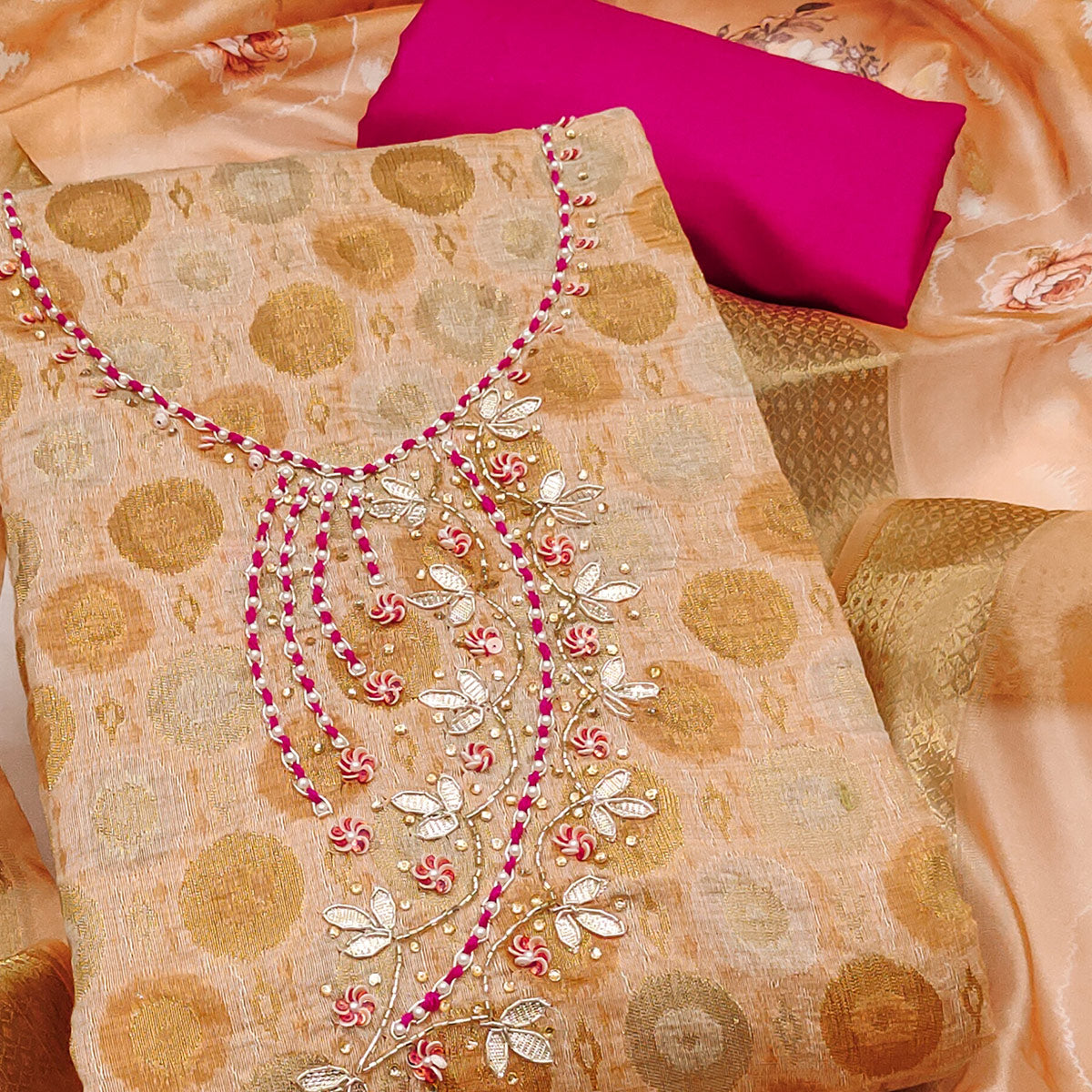 Sophisticated Light Peach Zari Woven Jacquard Dress Material Highlighted With Floral Handwork