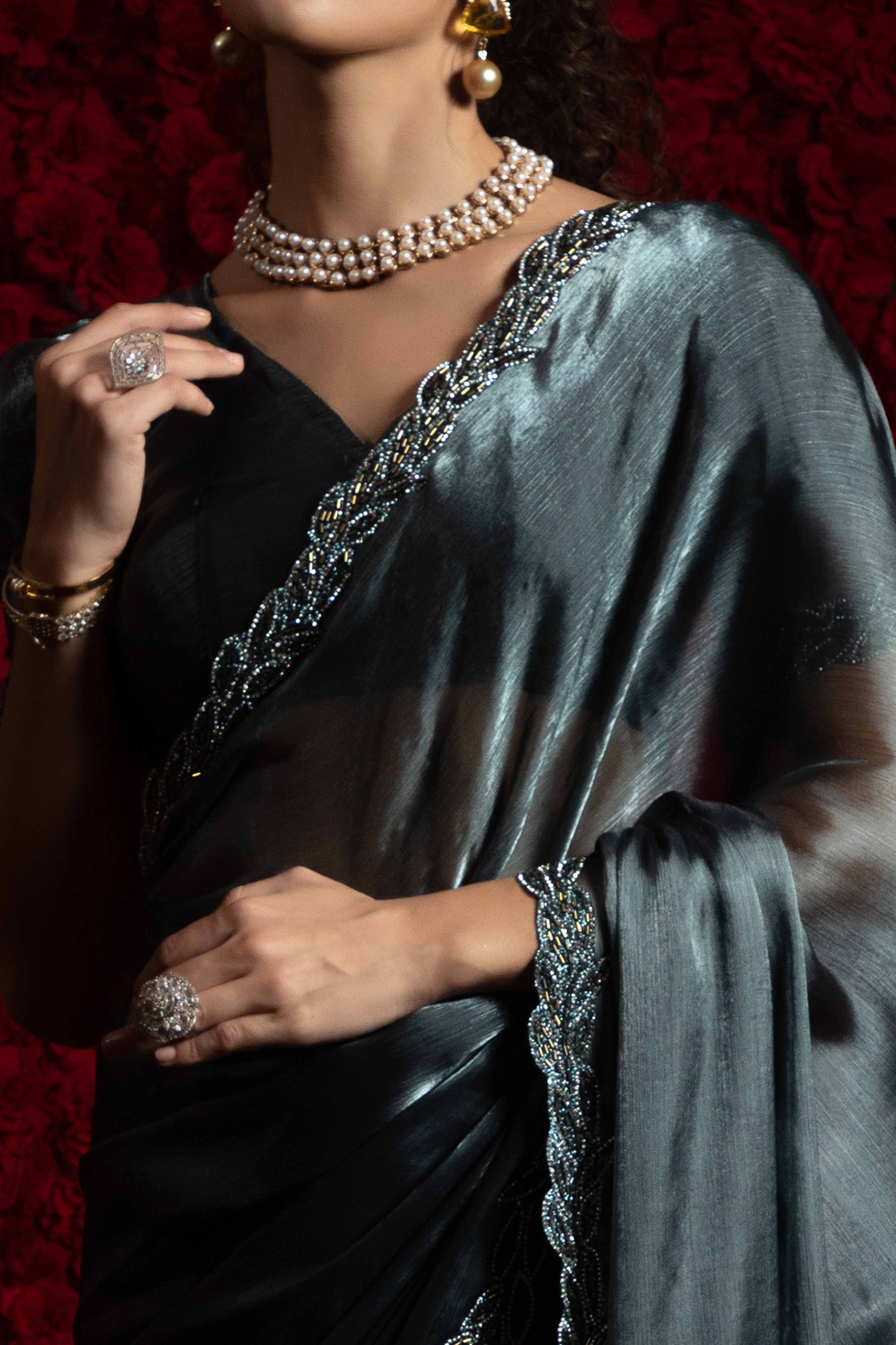 Grey Solid Tissue Chiffon Saree Accented With Elegant Zarkan Work Border