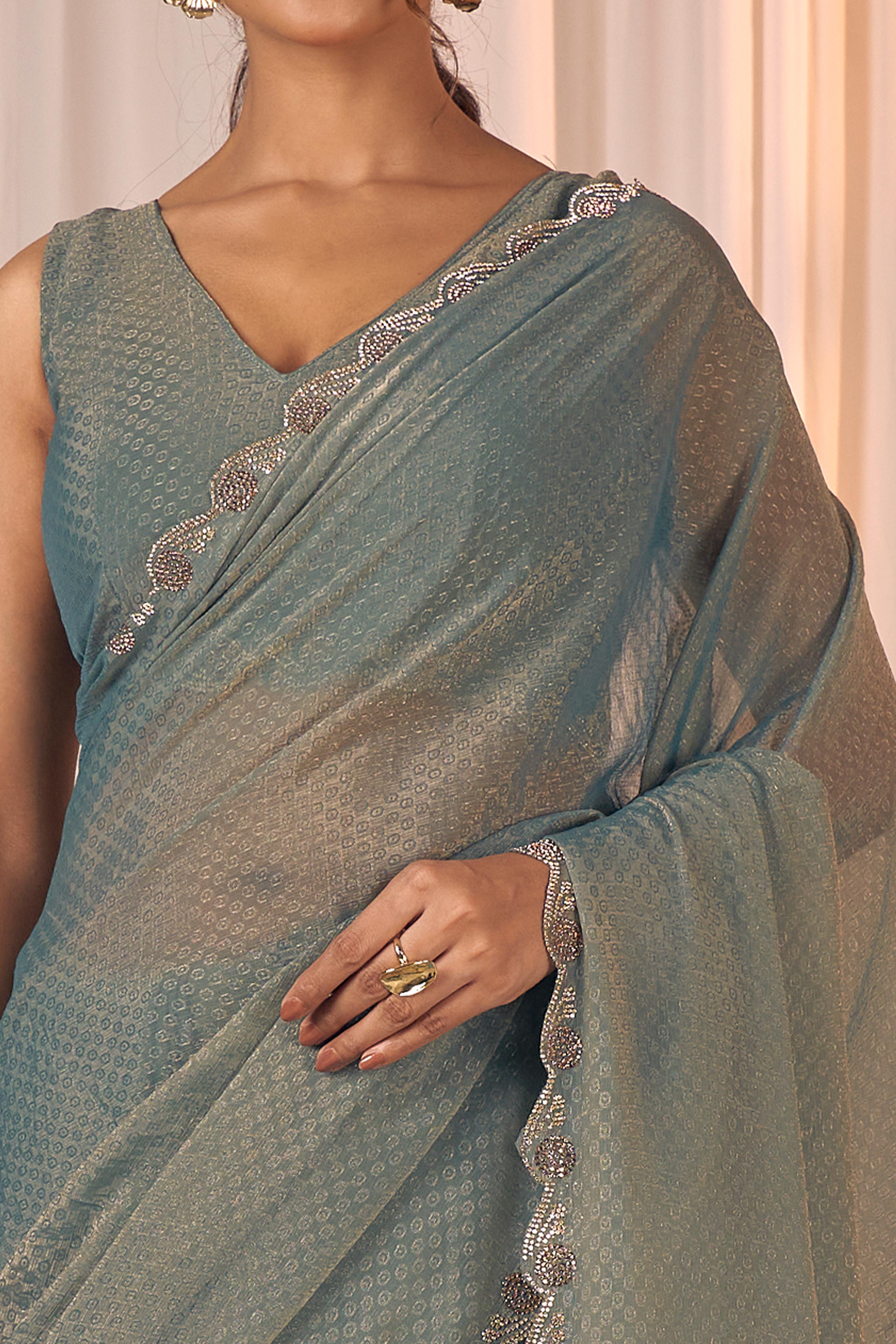 Designer Sage Green Georgette Saree Adorned With An Elegant Zarkan Cutwork Border