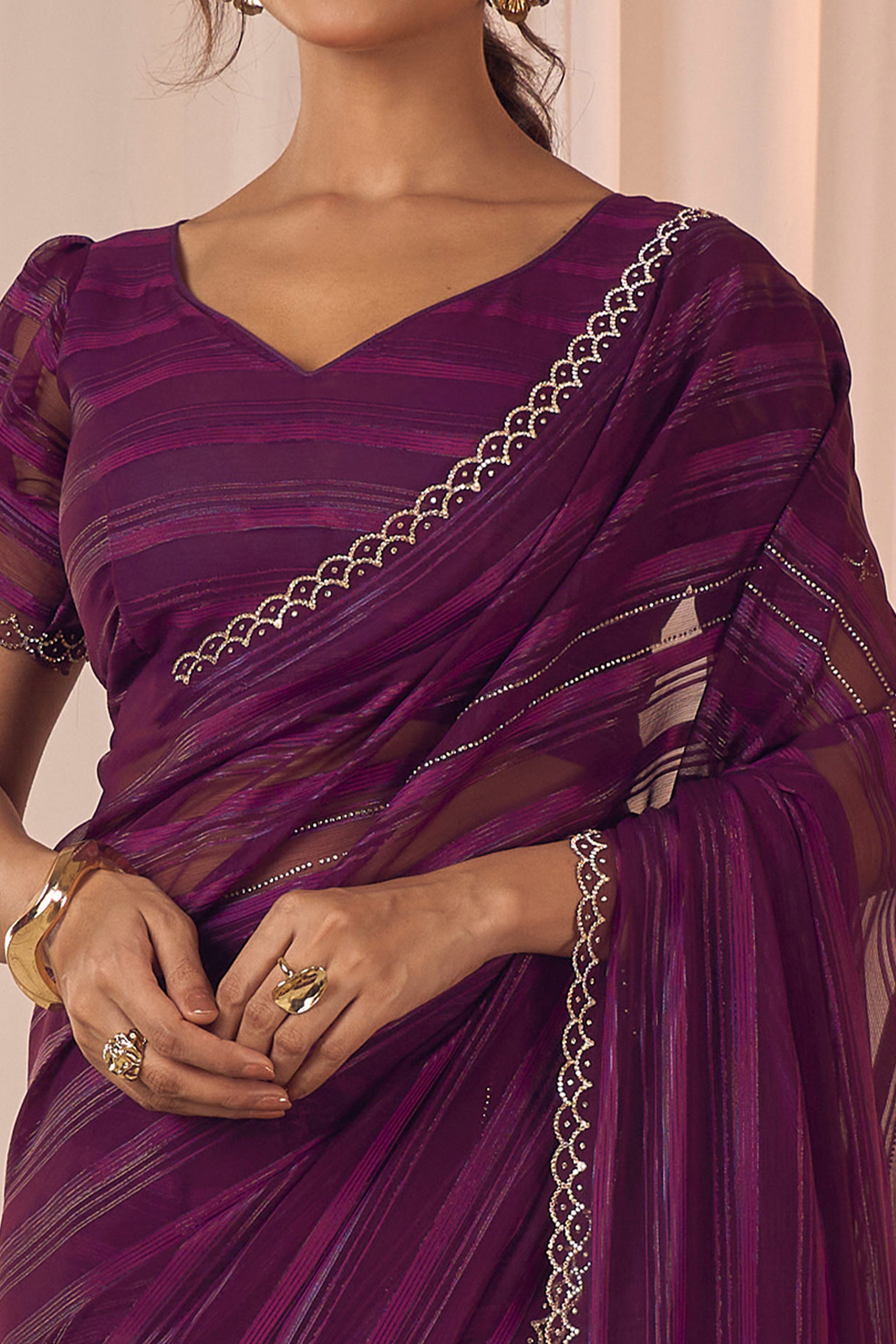 Wine Striped Designer Georgette Saree Adorned With An Elegant Zarkan Cutwork Border