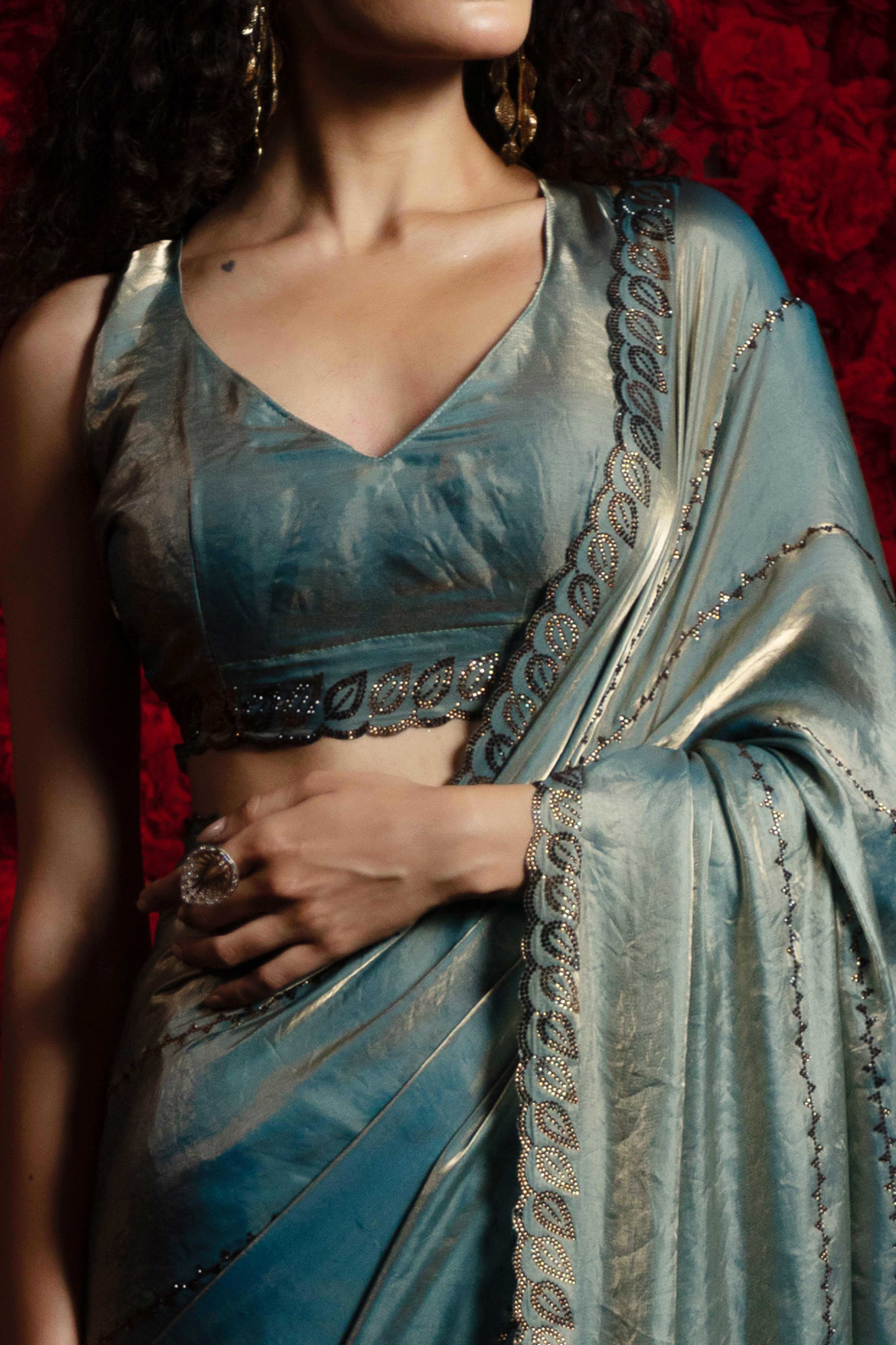 Teal Satin Silk Saree with Dazzling Stone Embellishments for Special Occasions