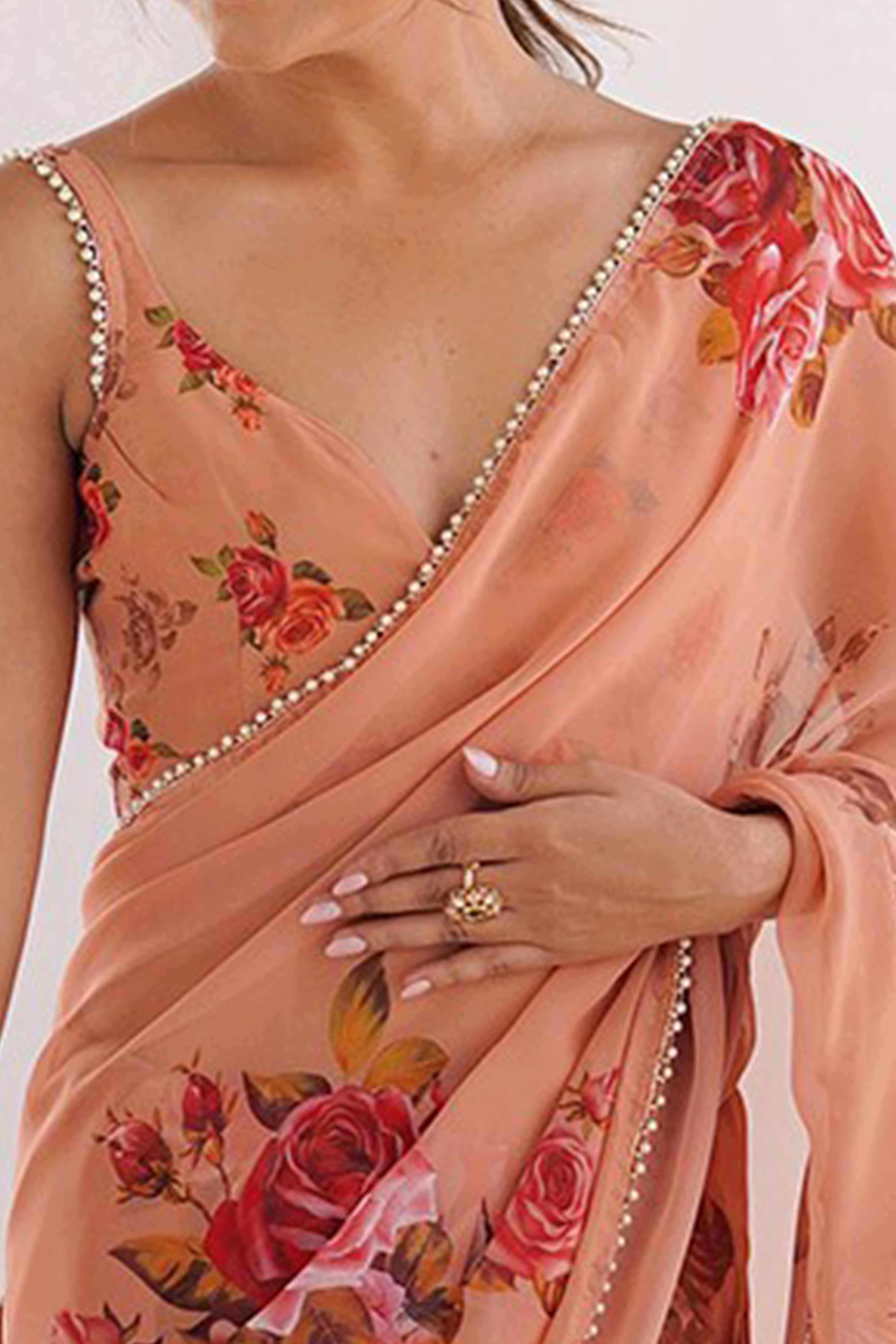 Partywear Peach Georgette Saree with Floral Prints and Bead Work Lace