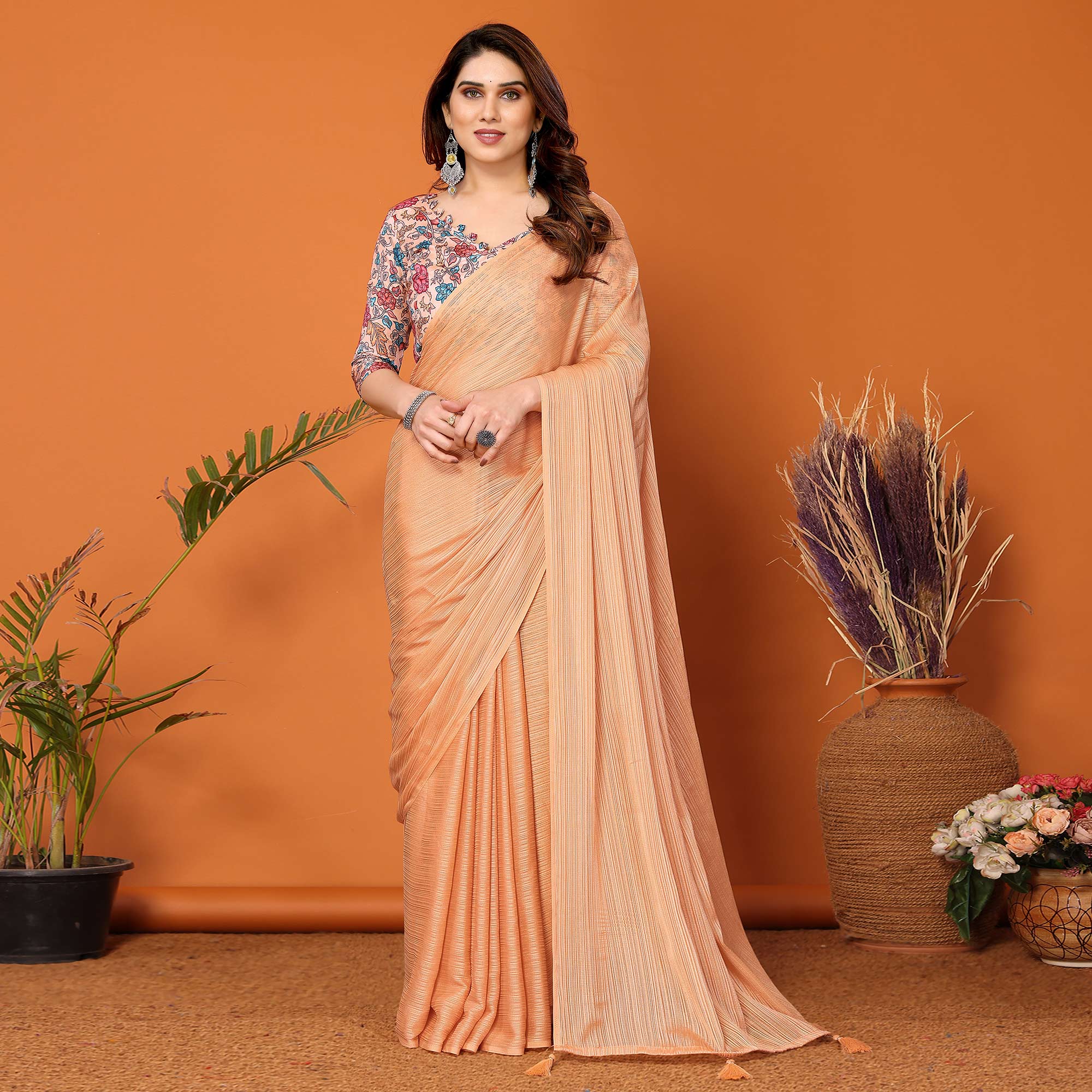 Light Orange Woven Satin Saree With Tassels