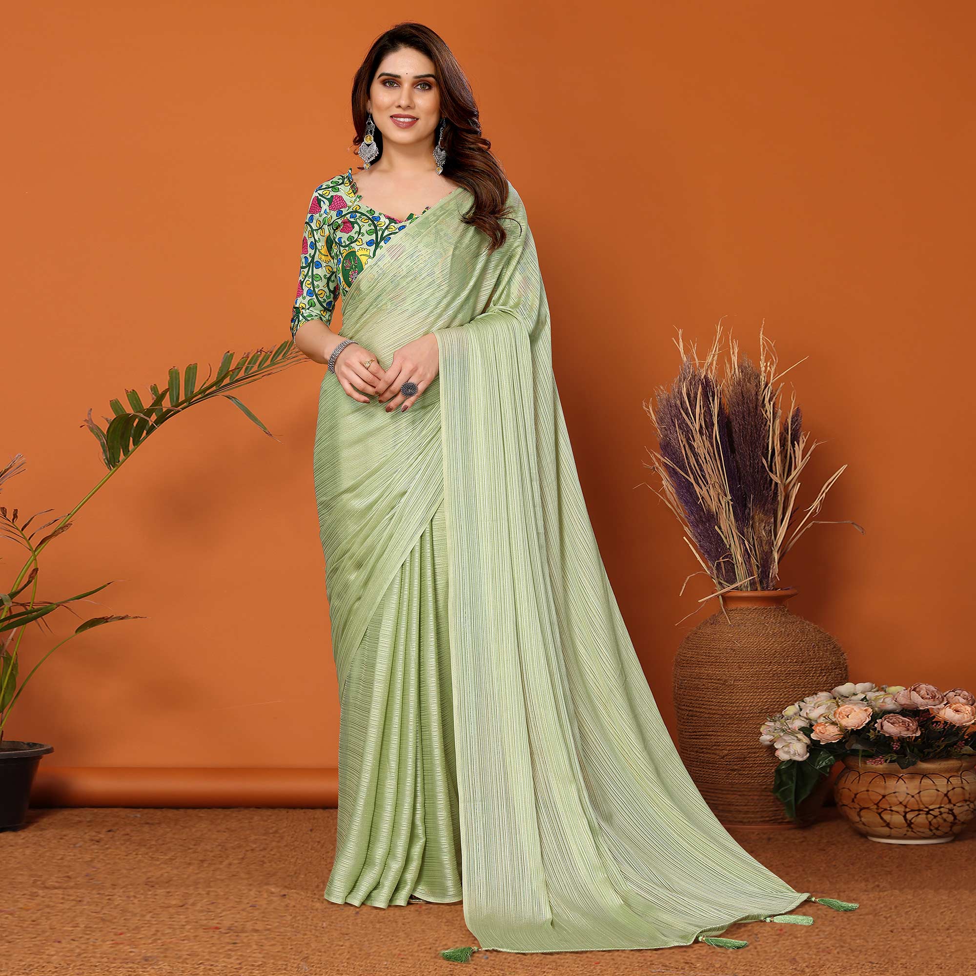 Pista Green Woven Satin Saree With Tassels