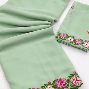 Green Faux Georgette Saree Featuring Minimalist Floral Border Embroidery