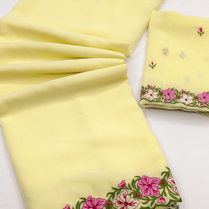 Yellow Faux Georgette Saree Featuring Minimalist Floral Border Embroidery